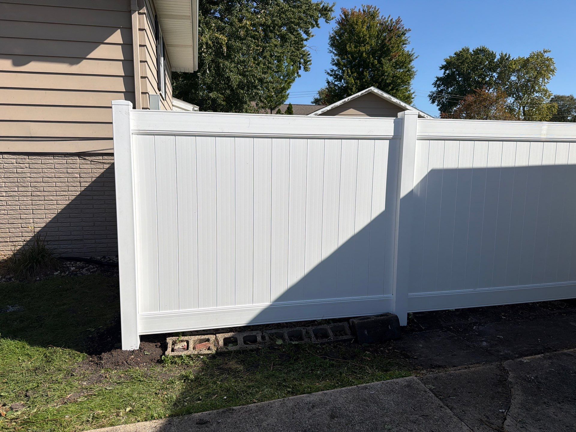 Custom Vinyl Privacy and Black Chain Link Fence Installation in Cedar Falls by Perfect Picket Fence and Stain