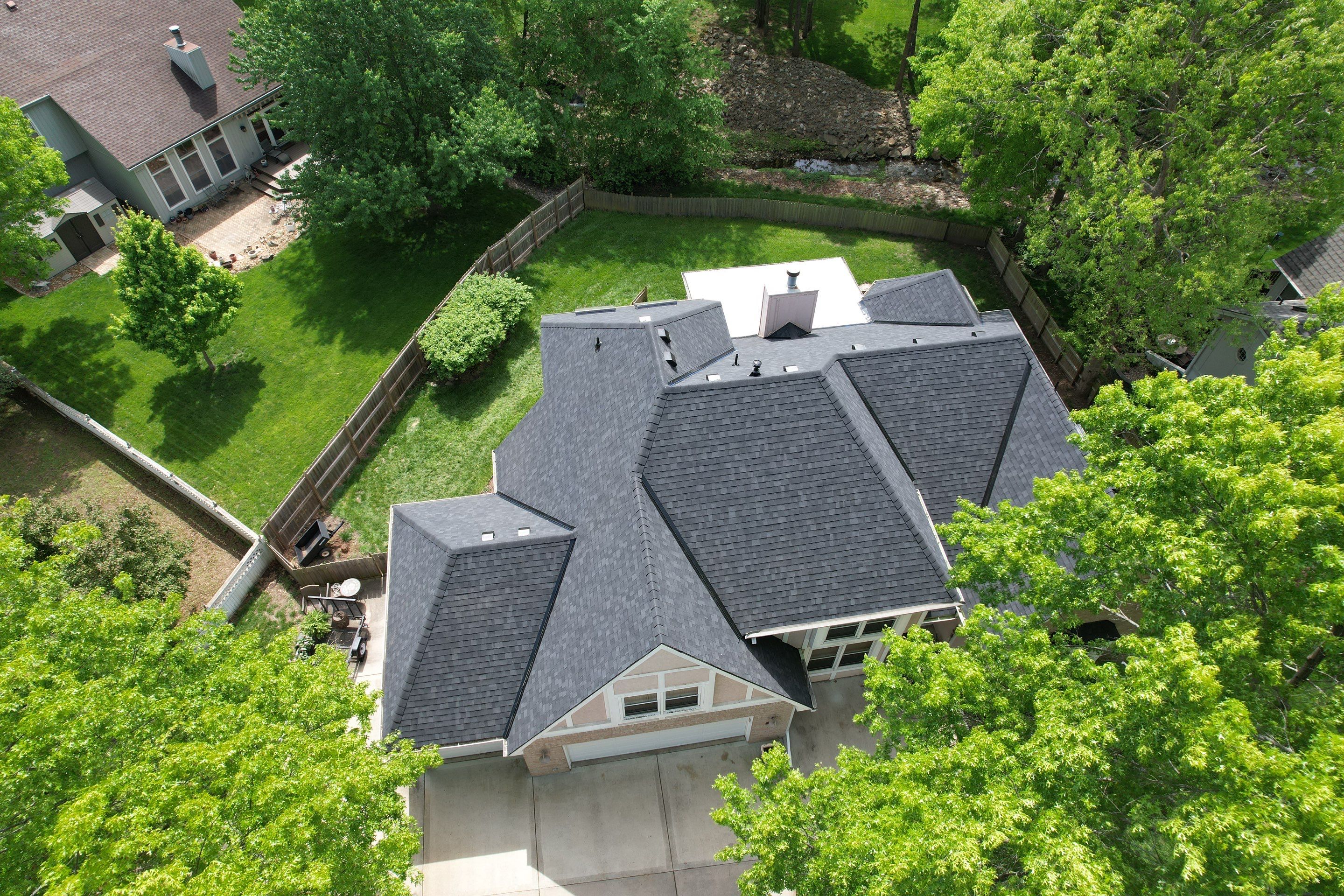 Comprehensive Roof Replacement and Skylight Installation in Kansas City by Liberty Roofing