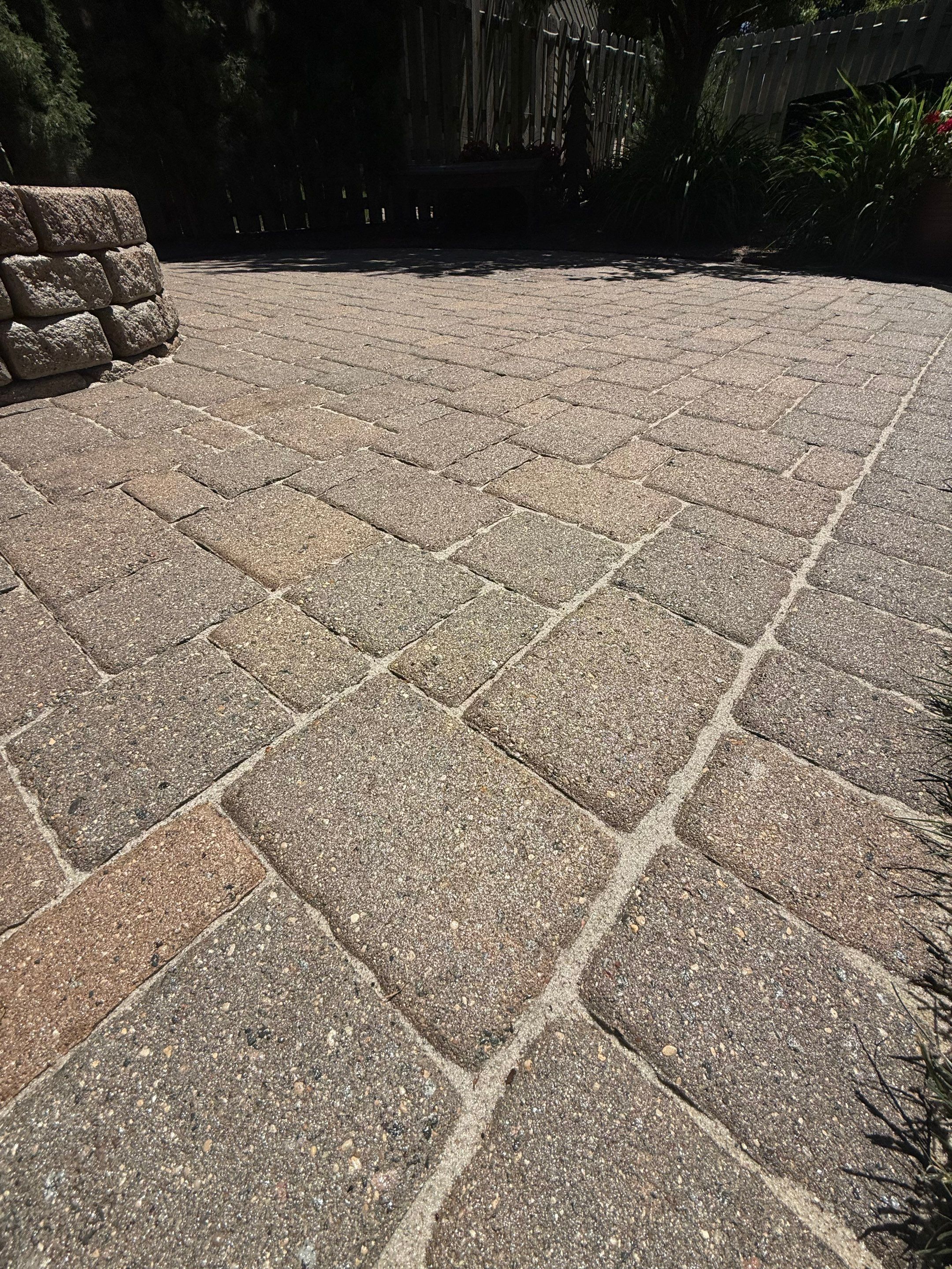 Textured Concrete Coating and Paver Patio Refresh in Sioux Falls by Select Painting, Coatings & Garage Cabinets