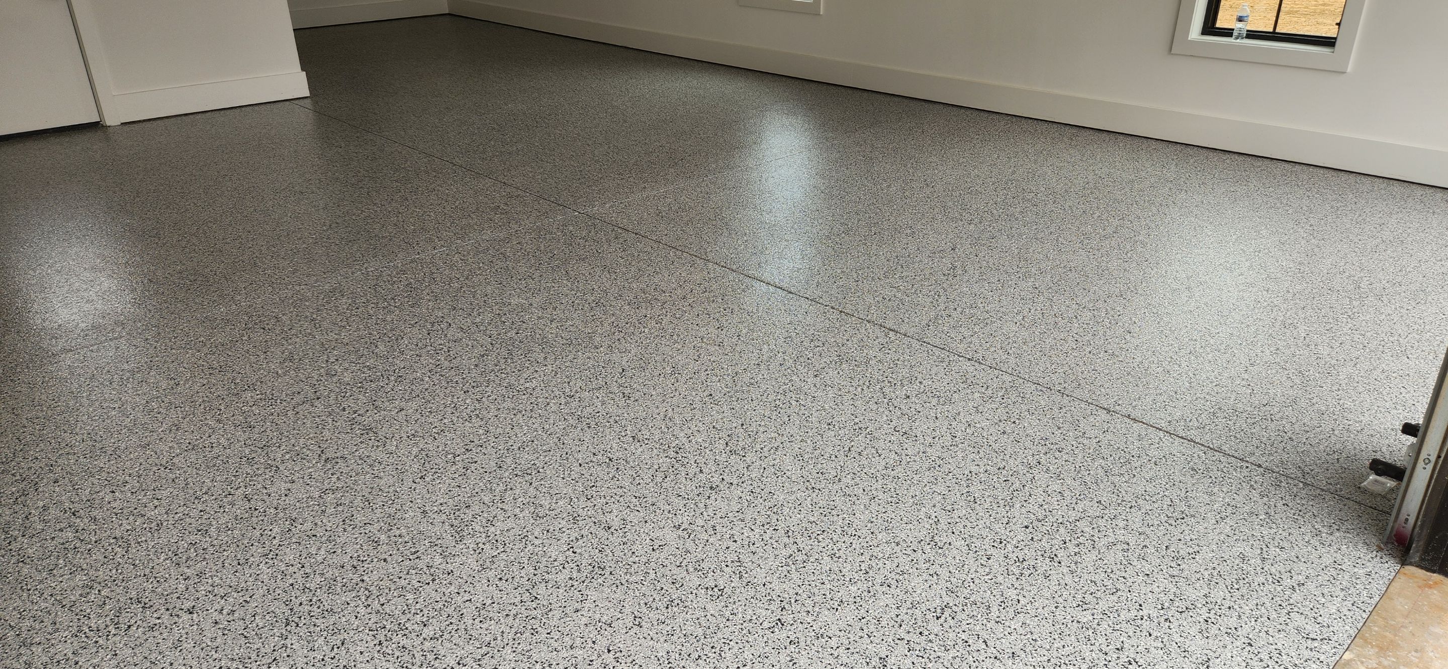 Garage Transformation Using Houndstooth by Elite Floor Solutions