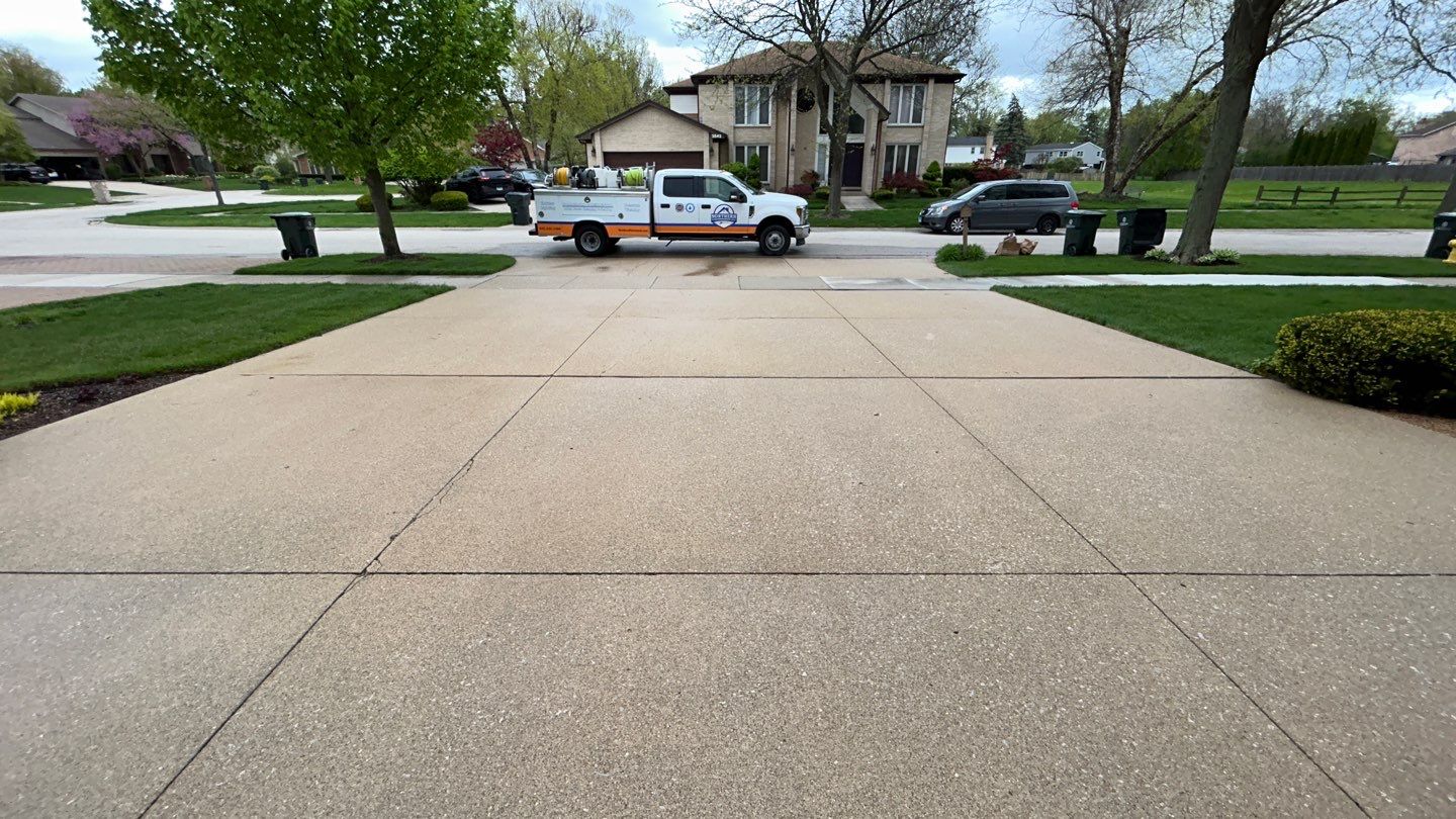 concrete patio and driveway cleaning by Northern Power Washing LLC.