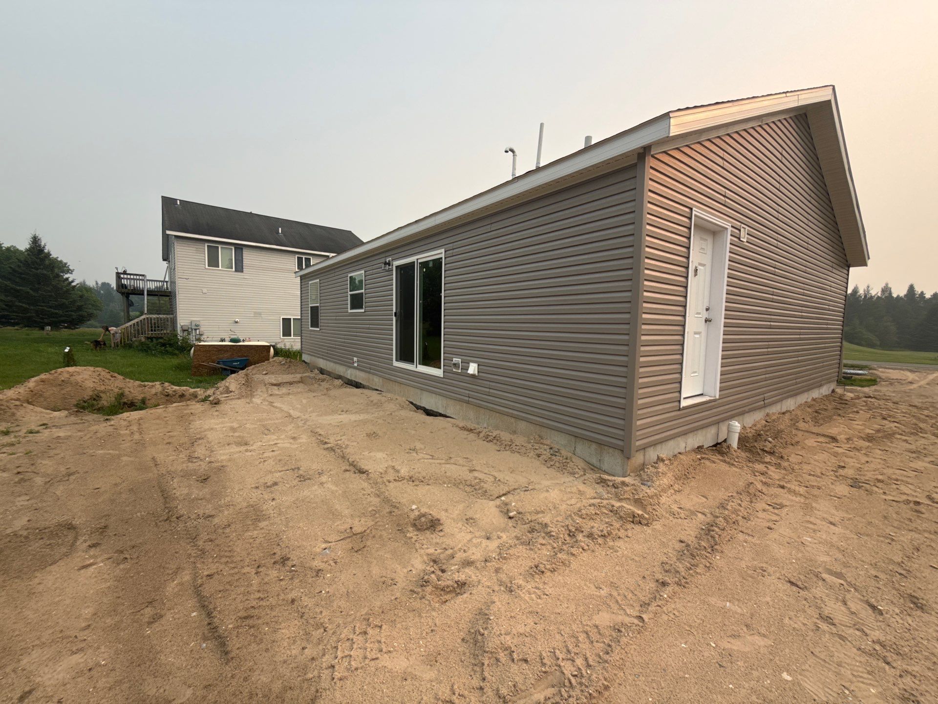 New Gutter System Installation for Boyne Falls Residential Home by Rainbow Seamless Systems