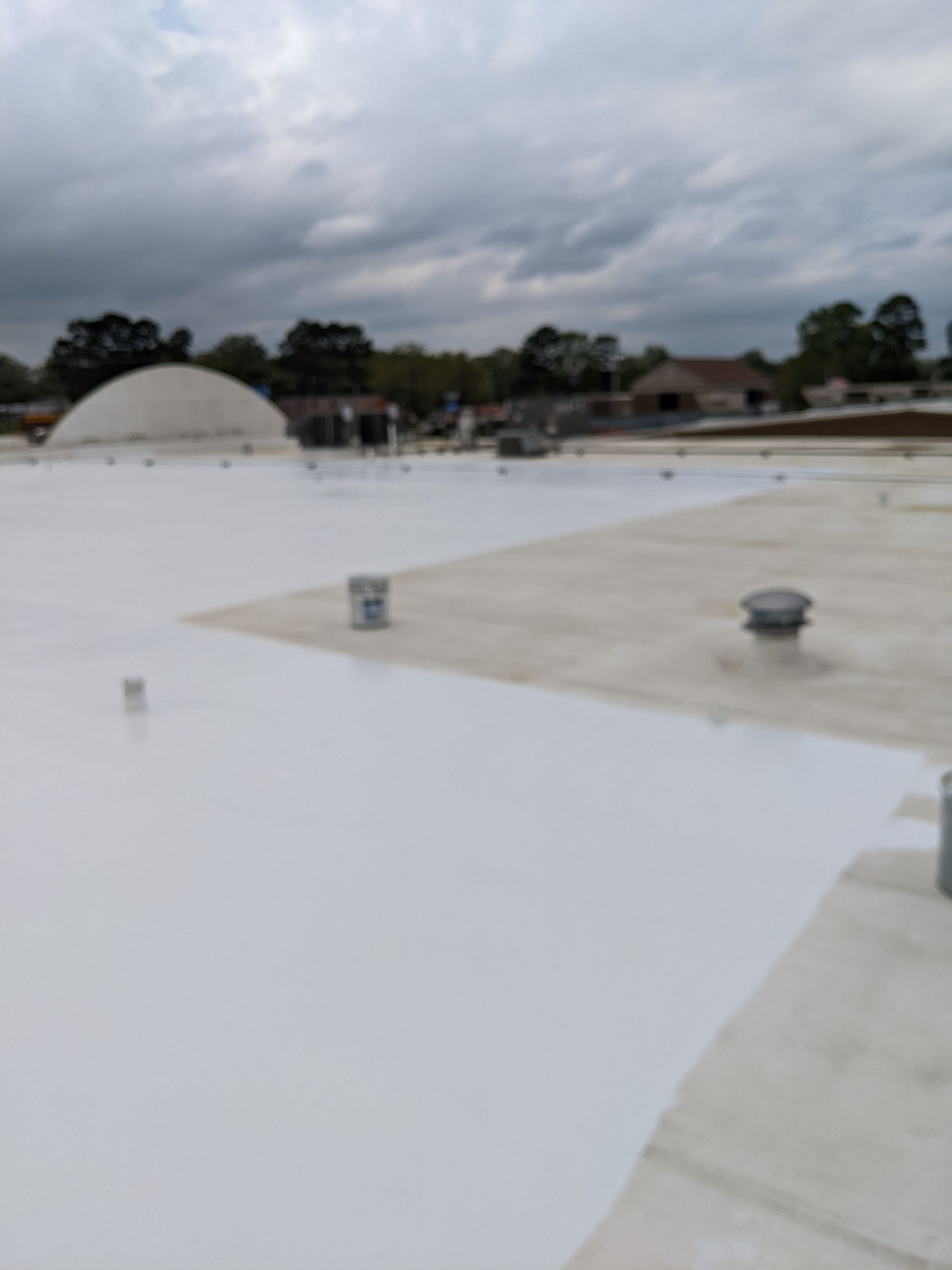 Commercial Roofing Installation using Aldocoat Coatings by Hostetler Roofing