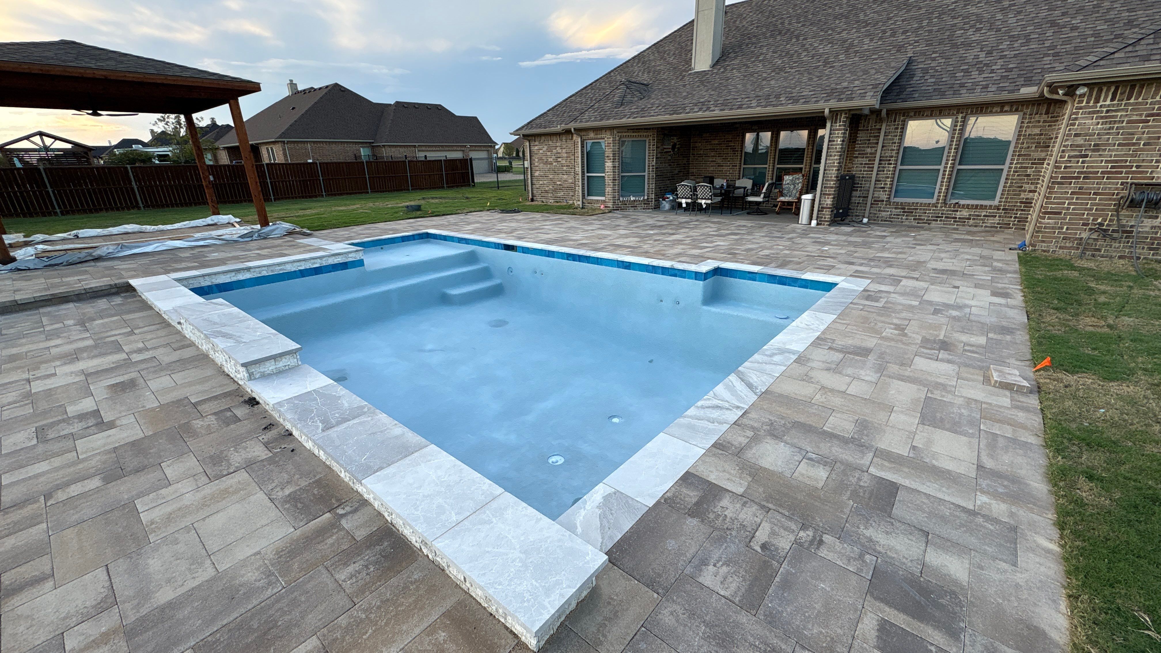 Modern Geometric Pool with Tanning Ledge by Pinnacle Pools and Spas - DFW