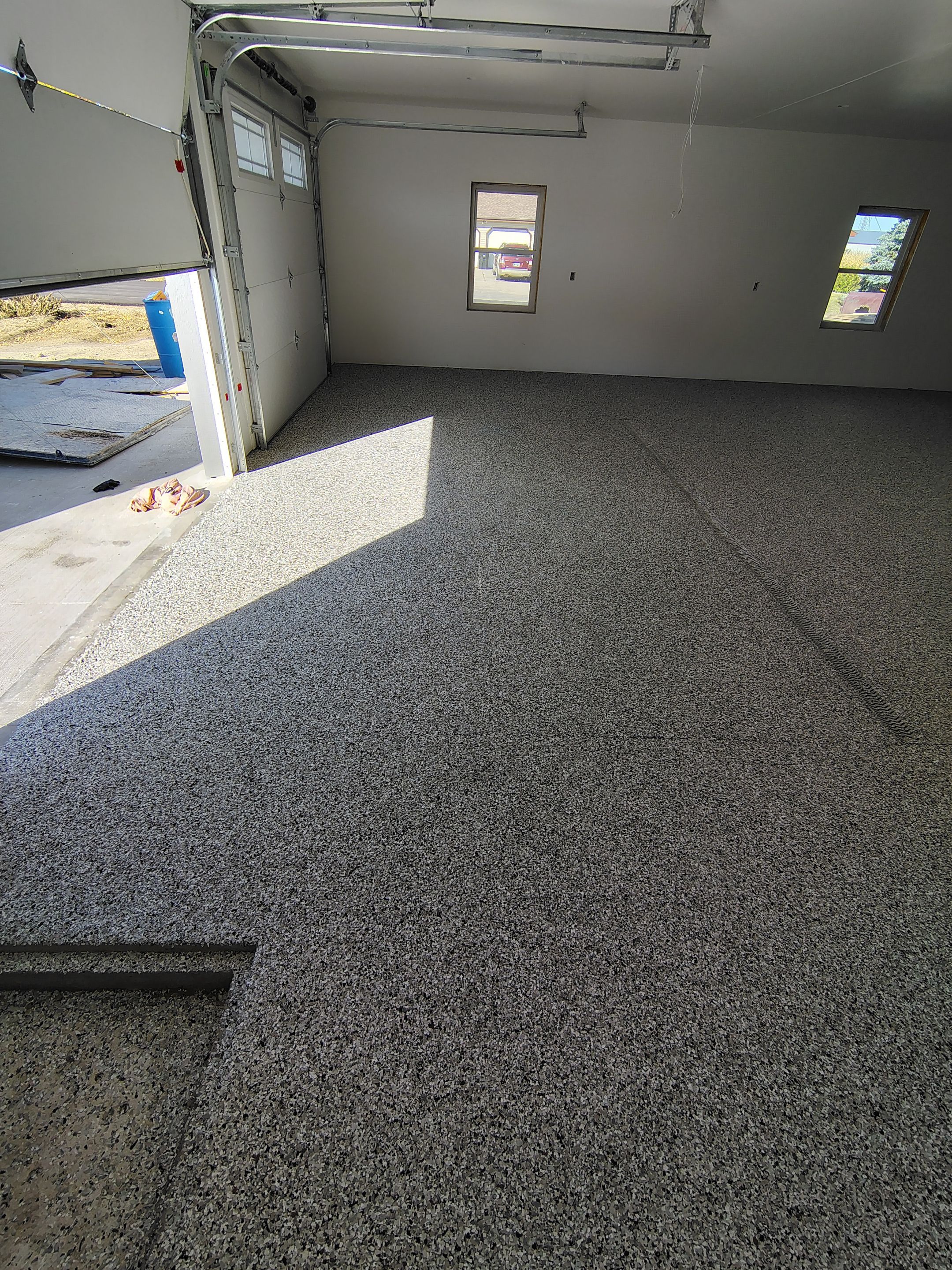 Custom Garage and Basement Epoxy Floor Coating in Menno by Select Painting, Coatings & Garage Cabinets