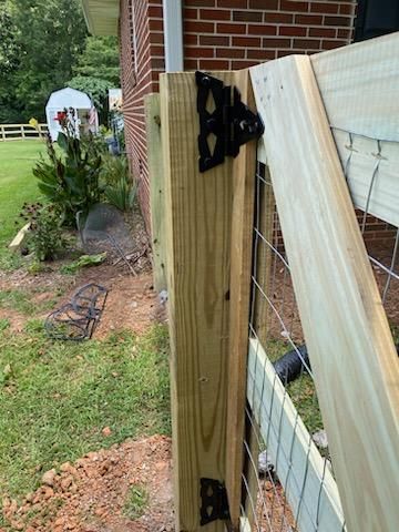 Fence Installation of 3 Rail Ranch with Wire Backing by Titans of Timber Fence & Stain