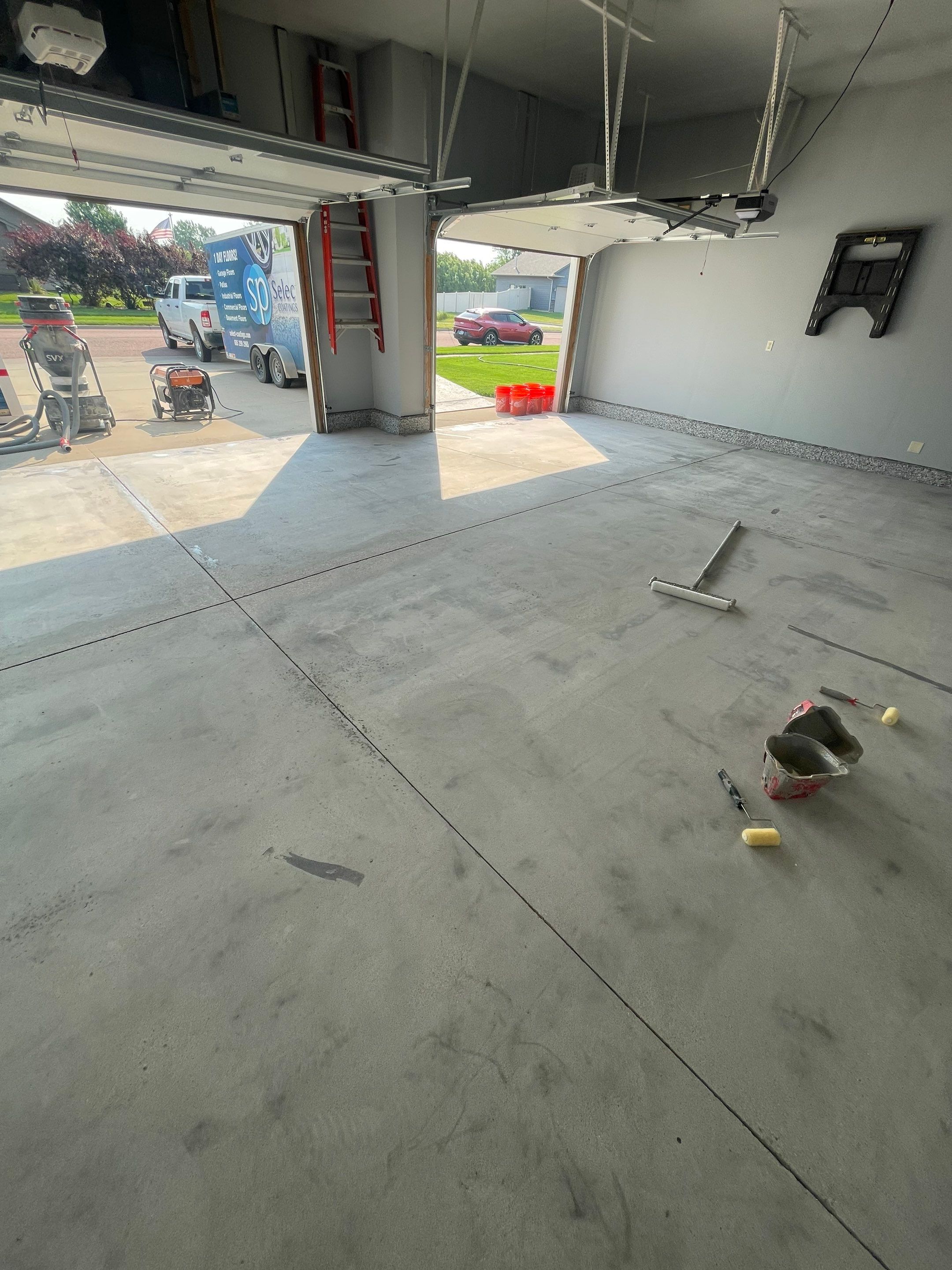 Sioux Falls Garage Concrete Coating Installation with Domino Flake by Select Painting, Coatings & Garage Cabinets