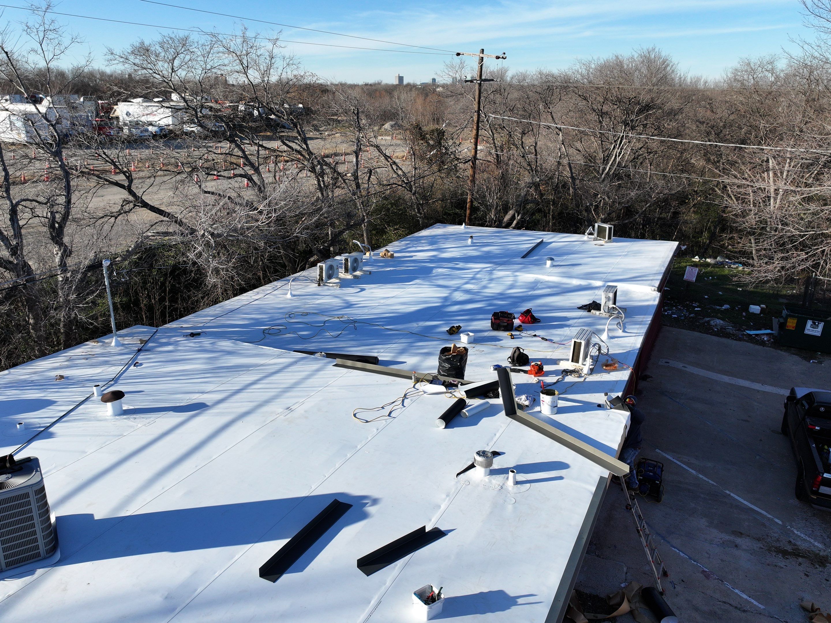 Commercial roofing overlay using GAF TPO over an old ballast roof by Becker Roofing and Exteriors
