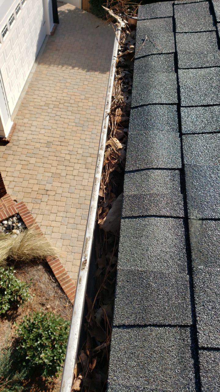 Gutter Cleaning using water by Power Wash Masters LLC