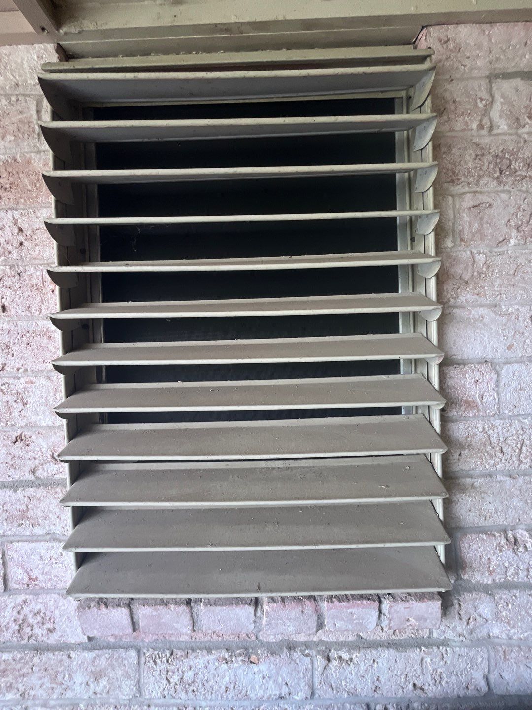 Colored Vinyl Windows to blend into brick by Bayfront Roofing and Construction
