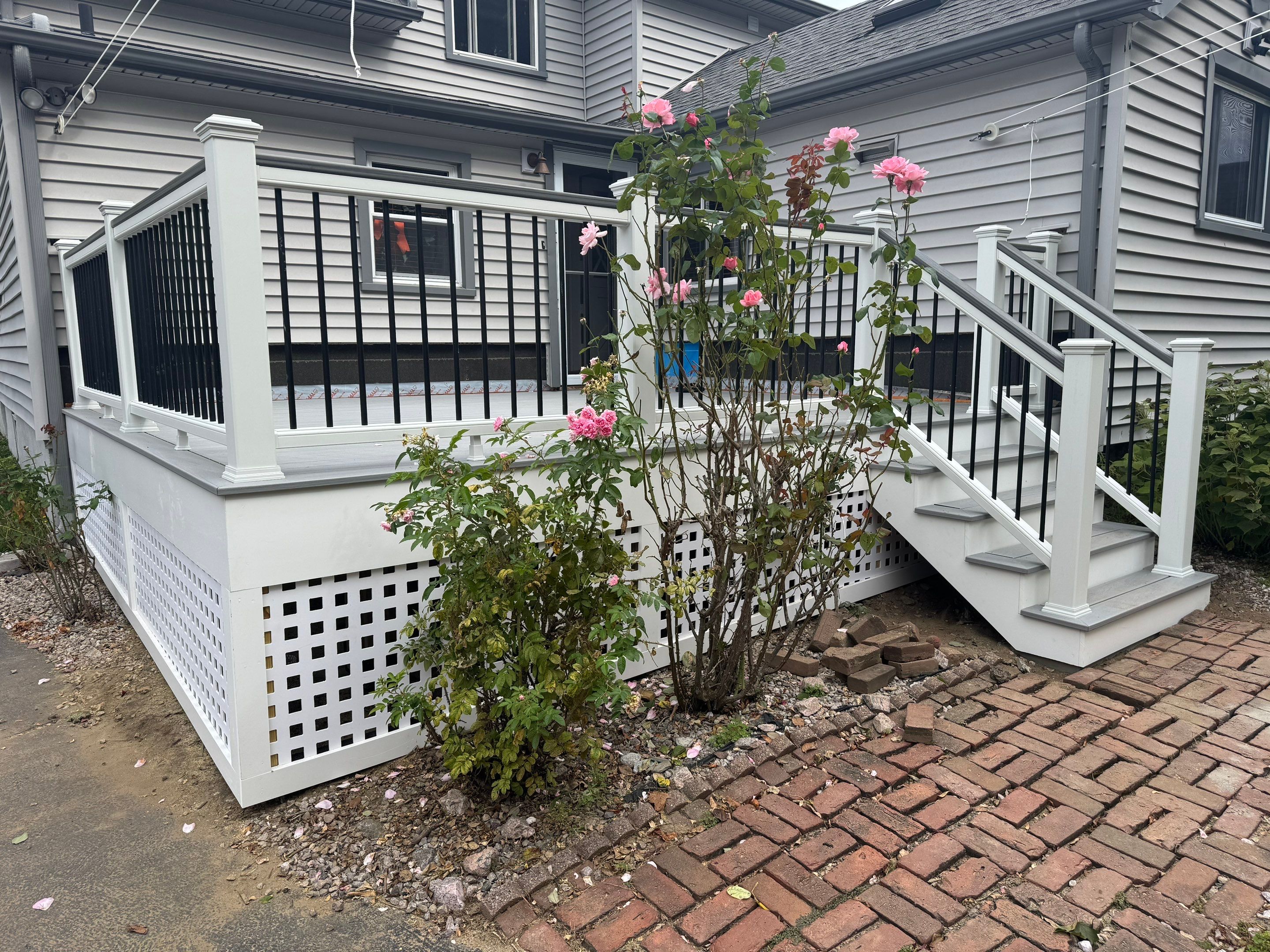 Deck Replacement using Trex Lineage Rainier with matching Cocktail rail and Lattice by DiGiorgi Roofing and Siding Inc