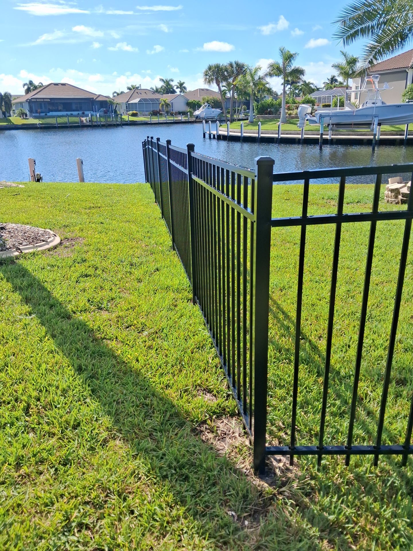 Custom Black Aluminum Fence Enclosure for Punta Gorda Waterfront Property by True Fence LLC