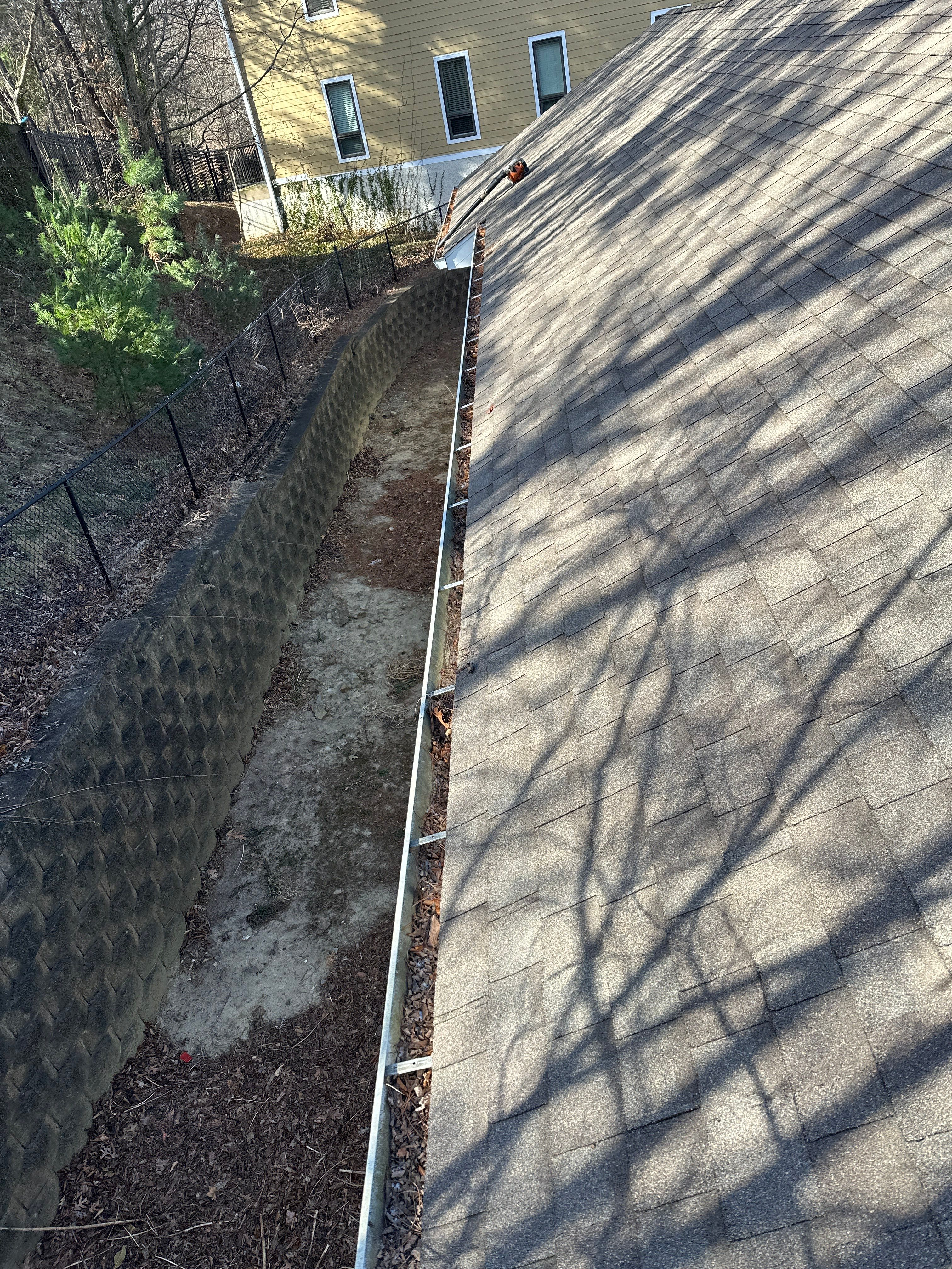 Commercial gutter cleaning Asheville before photo with filled gutters