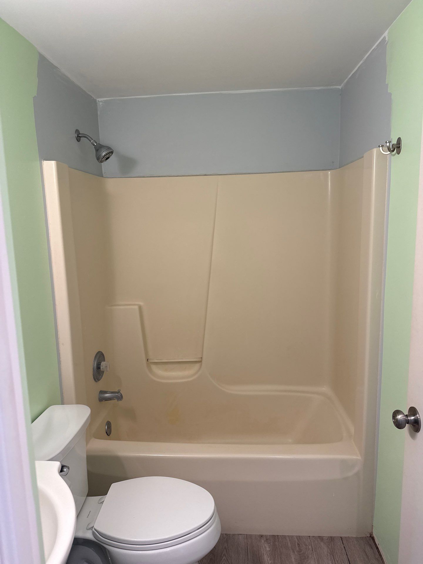 White Acrylic Walk-In Shower Installation in Boyne City by Rainbow Seamless Systems