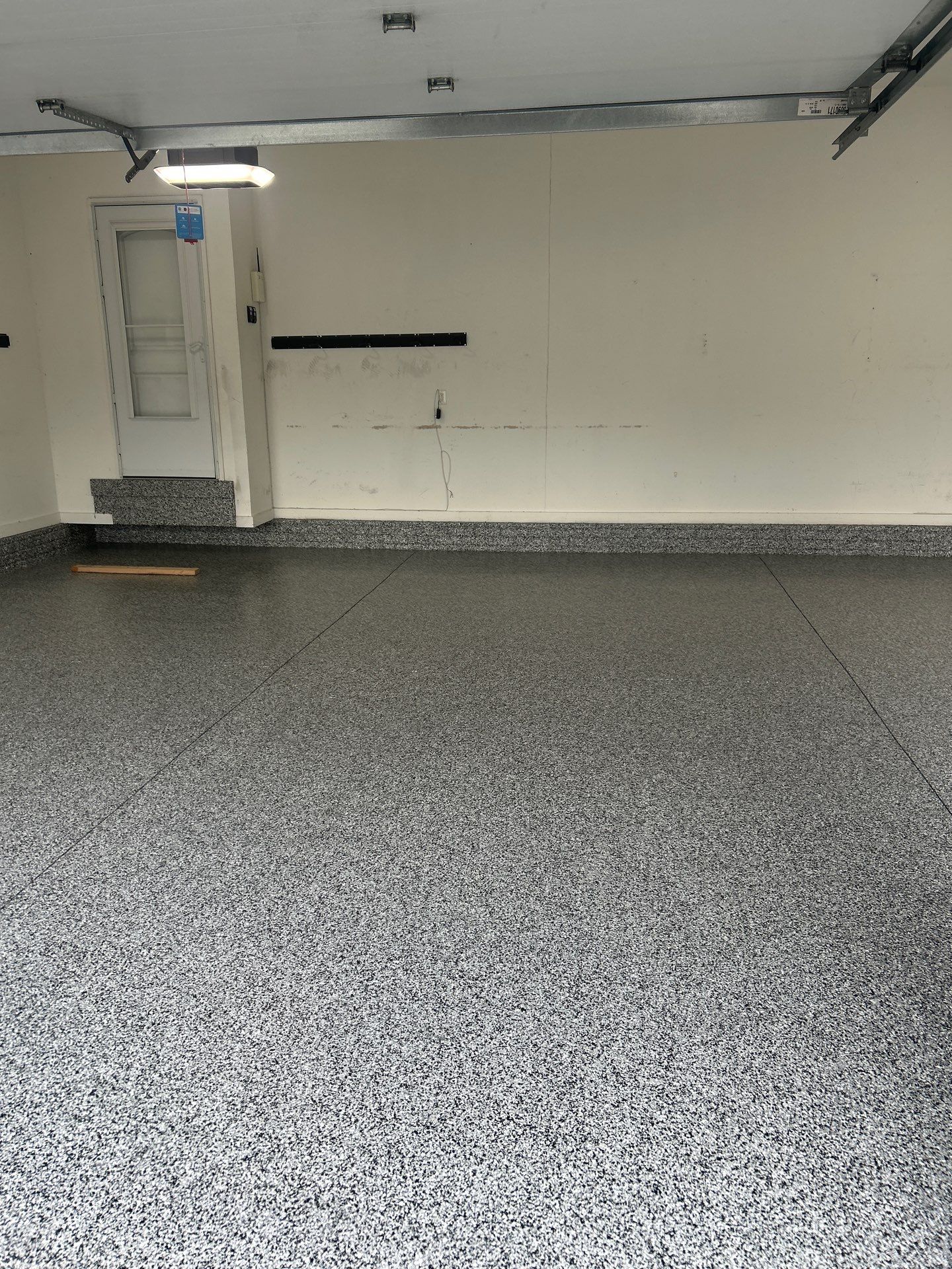 Garage Floor Coating using Domino Flake by Revival Concrete Coatings, LLC