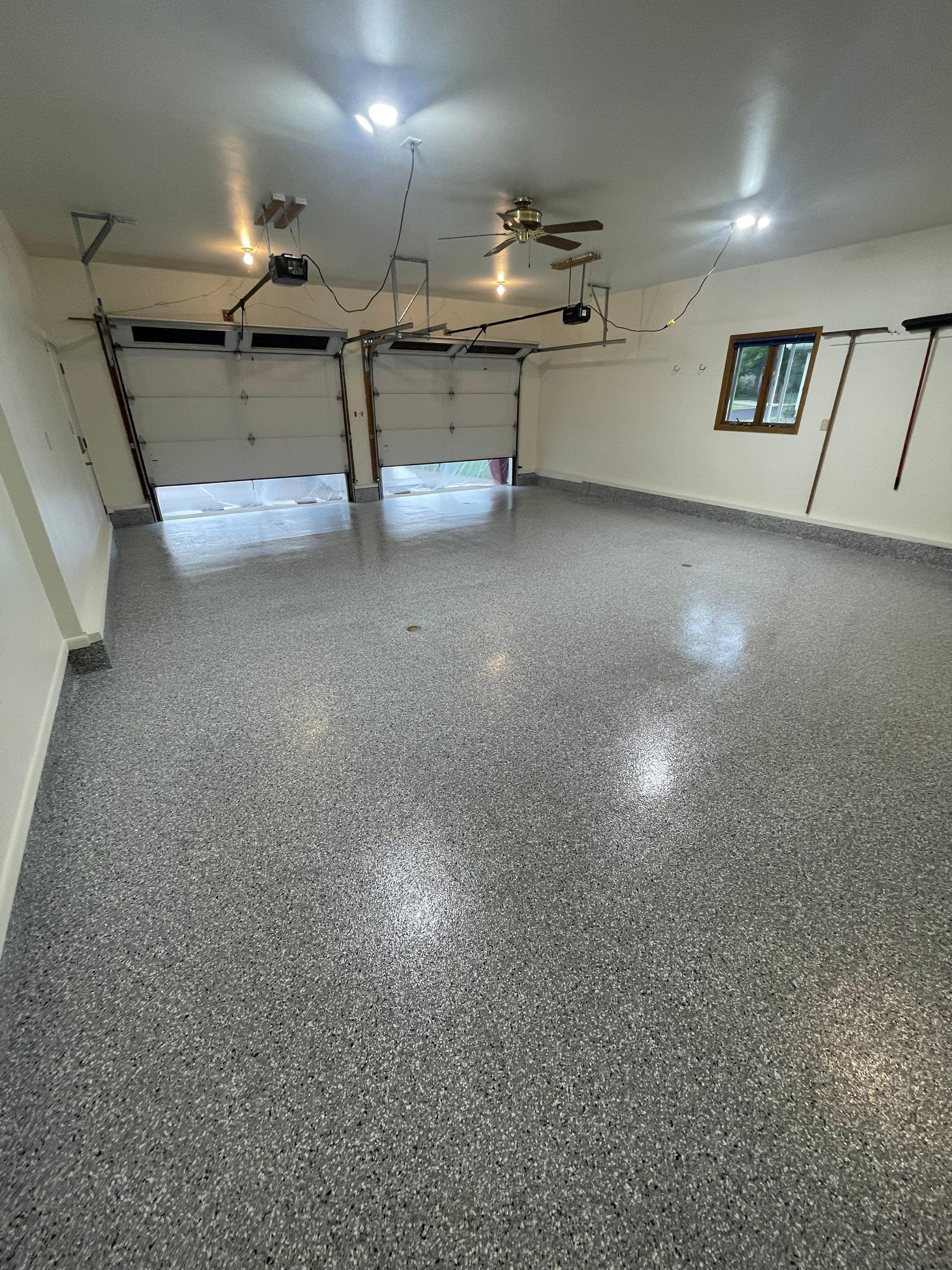 Madison Garage Concrete Coating with Feather Grey Speckle Finish by Select Painting, Coatings & Garage Cabinets