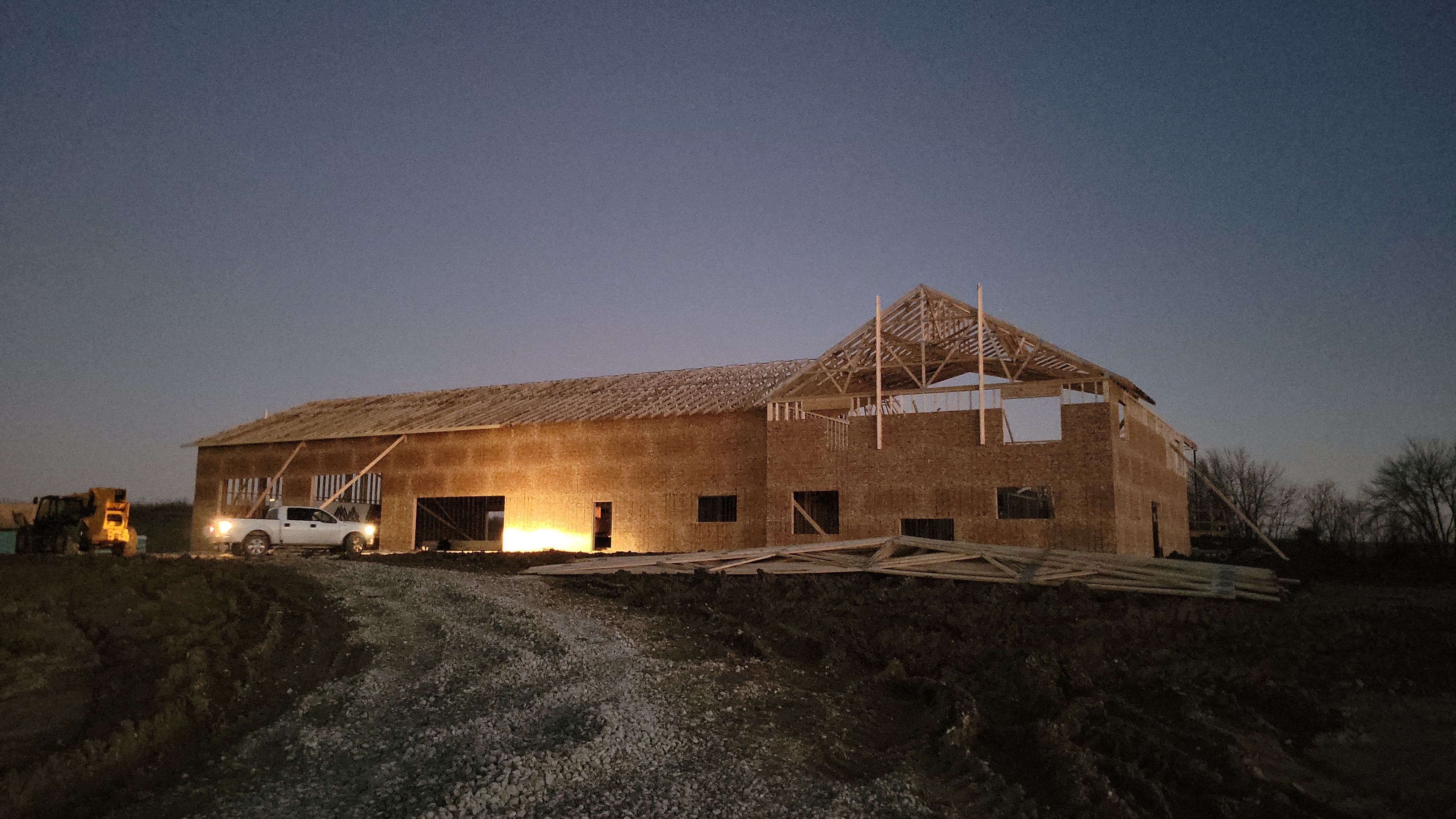 New Home construction w/ board and batten sides and metal roof  by Miles Construction 
