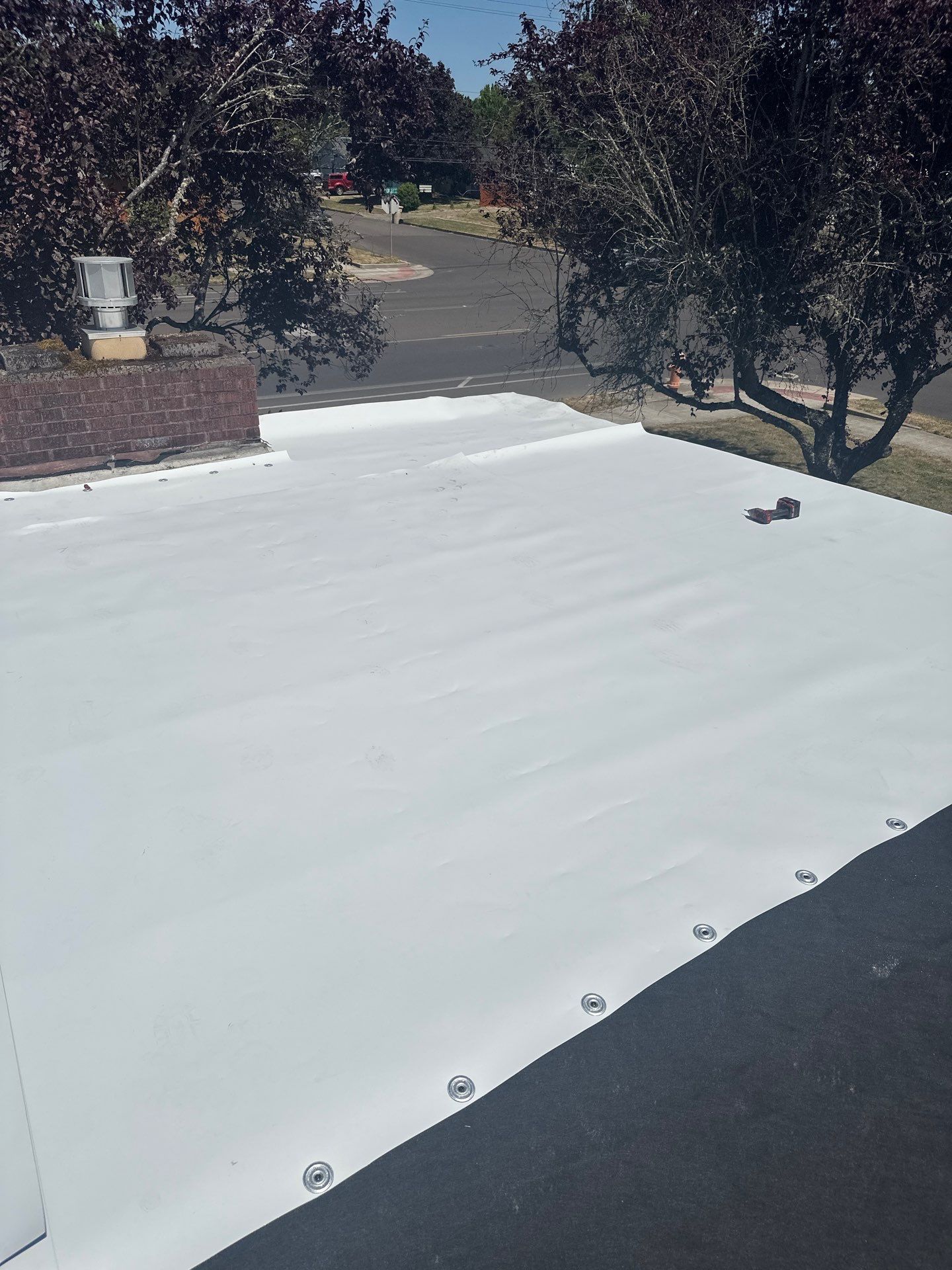 Residential Flat Roof Installation using GAF 60Mil TPO  by Orezona Building & Roofing Company, Inc.
