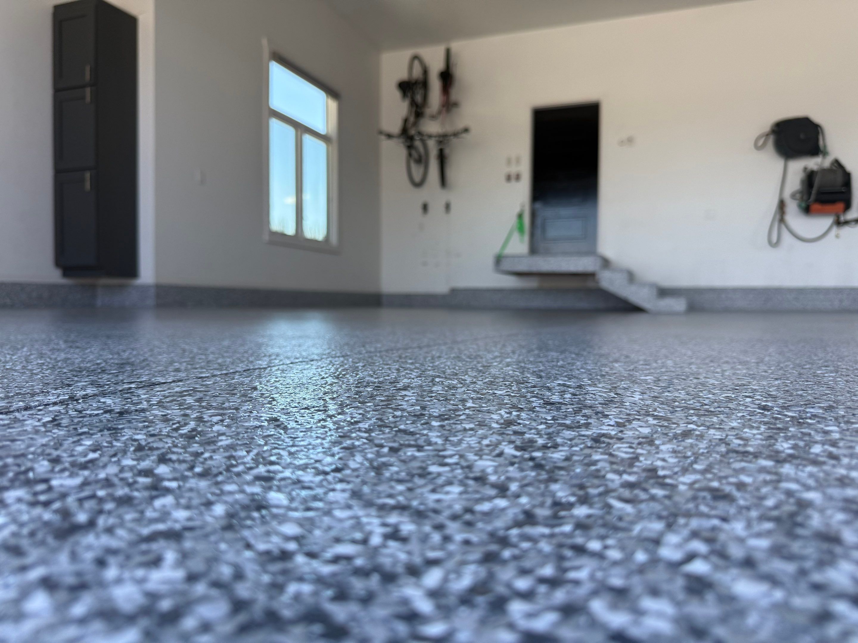 Gravel Flake Garage Floor Coating in Yankton by Select Painting, Coatings & Garage Cabinets