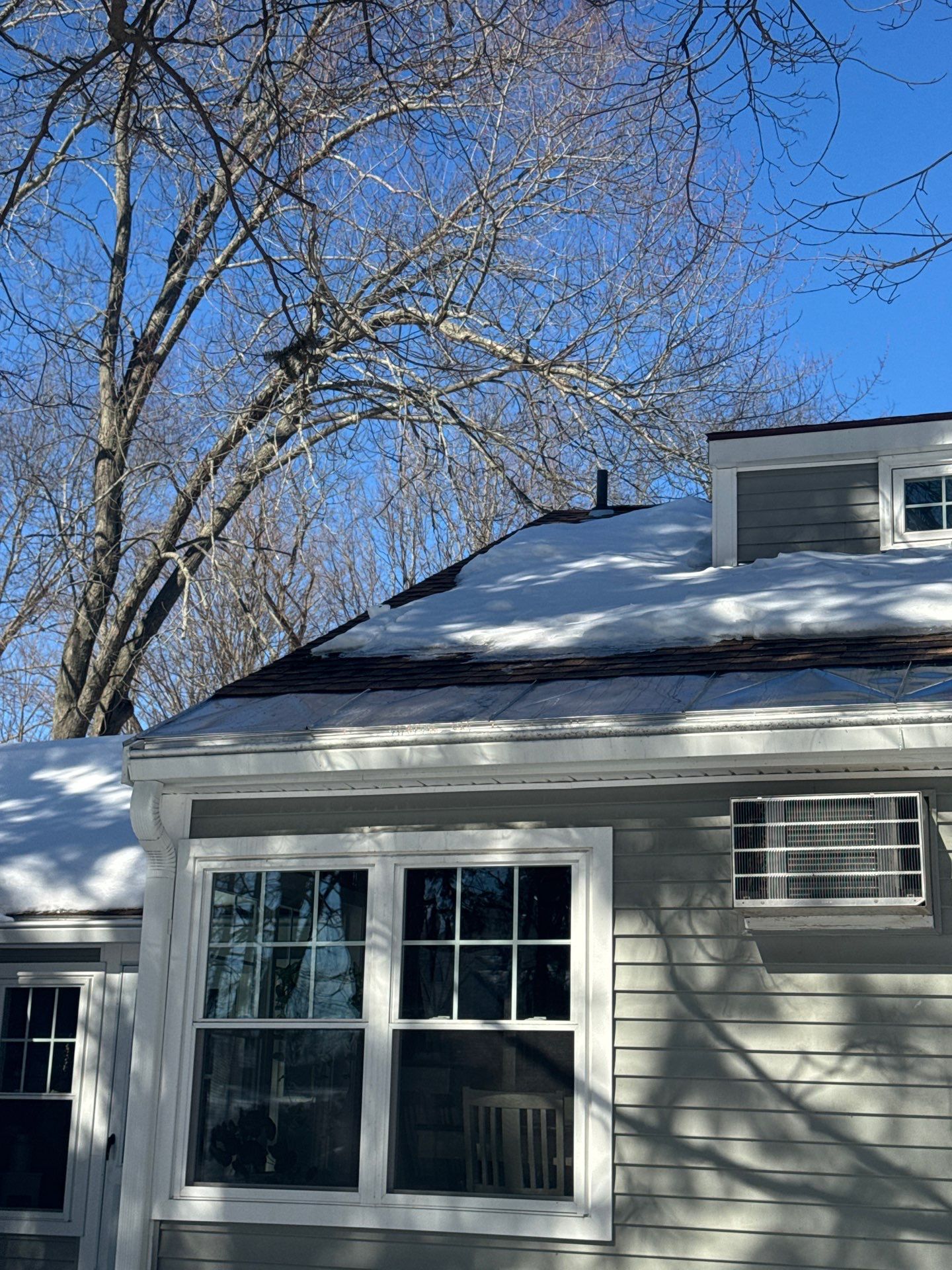 Snow/Ice Belt & Ice Dam Removal Project in Woburn by Mighty Dog Roofing of Greater Middlesex County