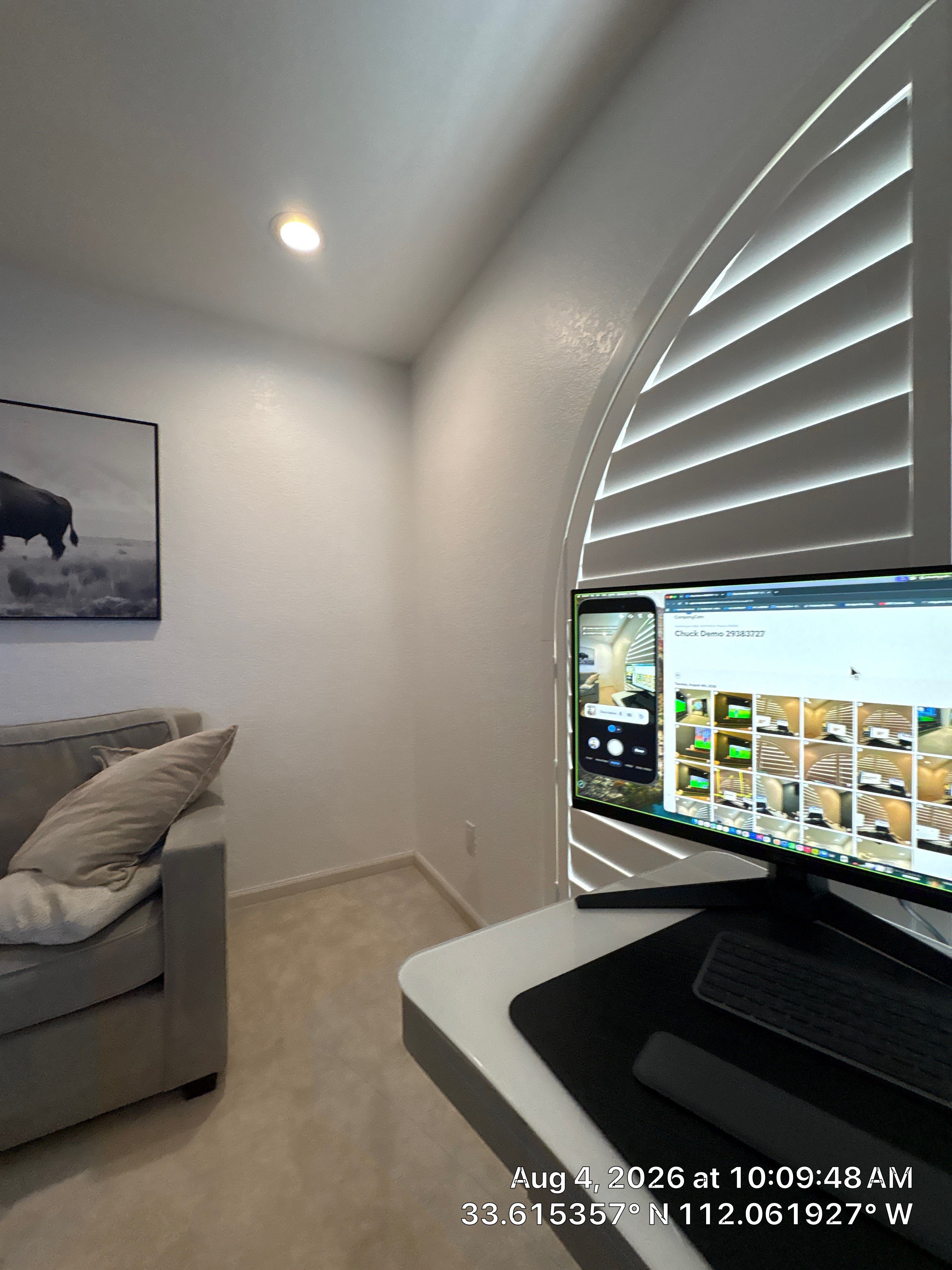 Custom Home Office Setup Featuring Arched Plantation Shutters and Accent Wall by CompanyCam Sales Demo