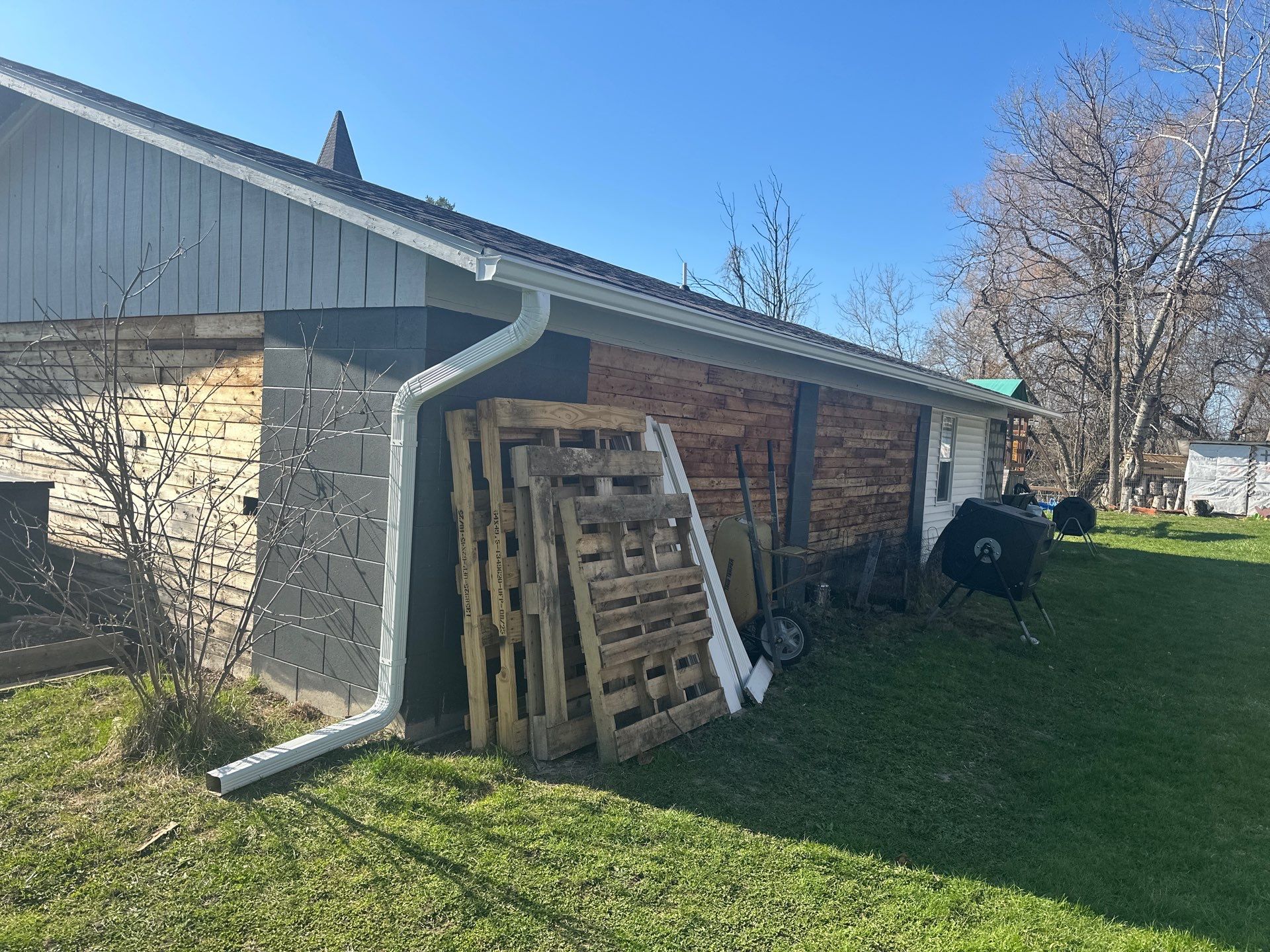 Residential Gutter and Downspout Installation in Elk Rapids by Rainbow Seamless Systems