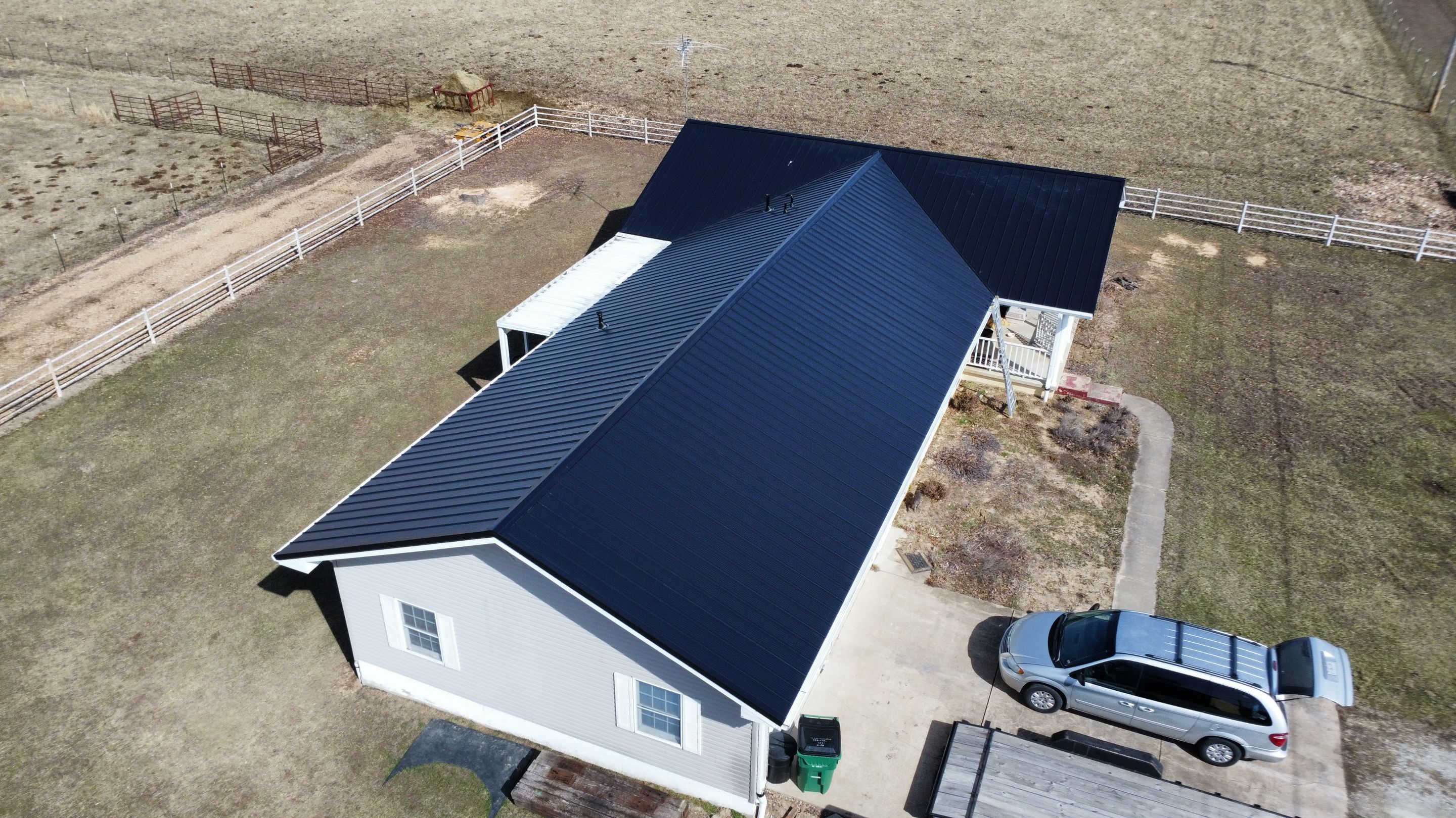 Residential 26 Gauge M-Rib Metal Roof + Gutters, Downspouts & Gutter Covers Install  by Titan Commercial & Residential Roofing 