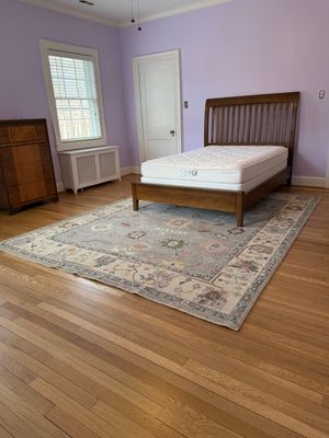 Two bedrooms with hardwood under carpet