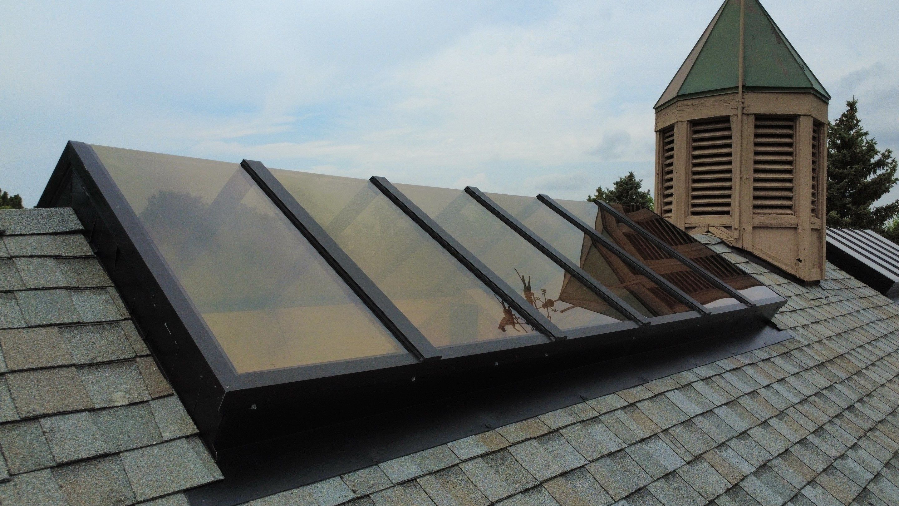 Asphalt Shingle and Skylight Replacement Project in Denver, CO by Blue Peaks Roofing LLC 