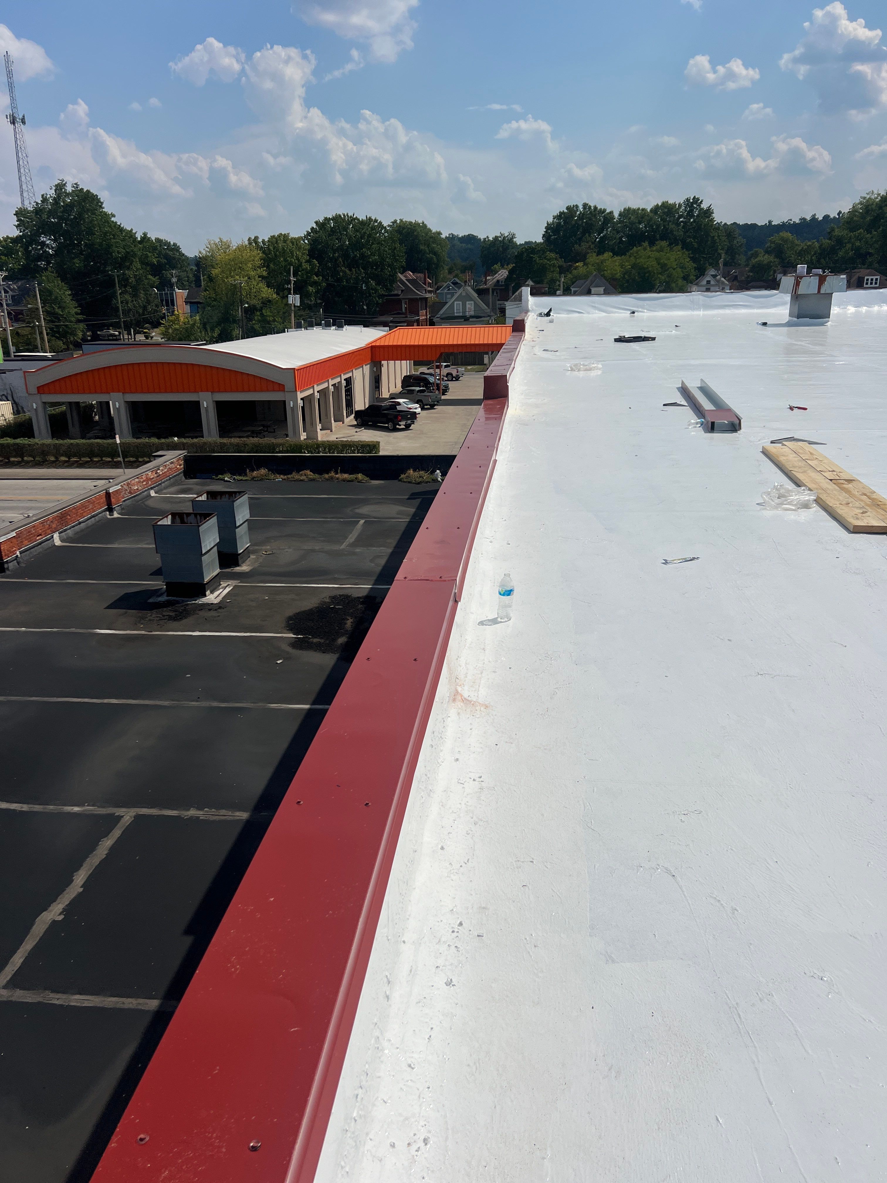 Commercial Roofing Installation using smartcoat Roof coating by Fahey Roofing + Contracting