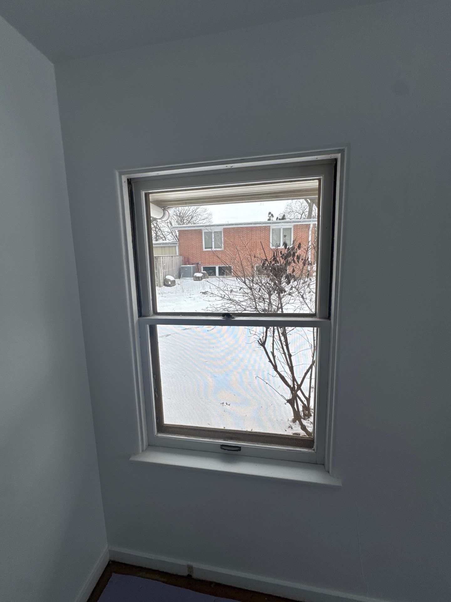 Black-Frame Pella Lifestyle Upgrade on a Partial Brick Home by United Windows and Siding LLC