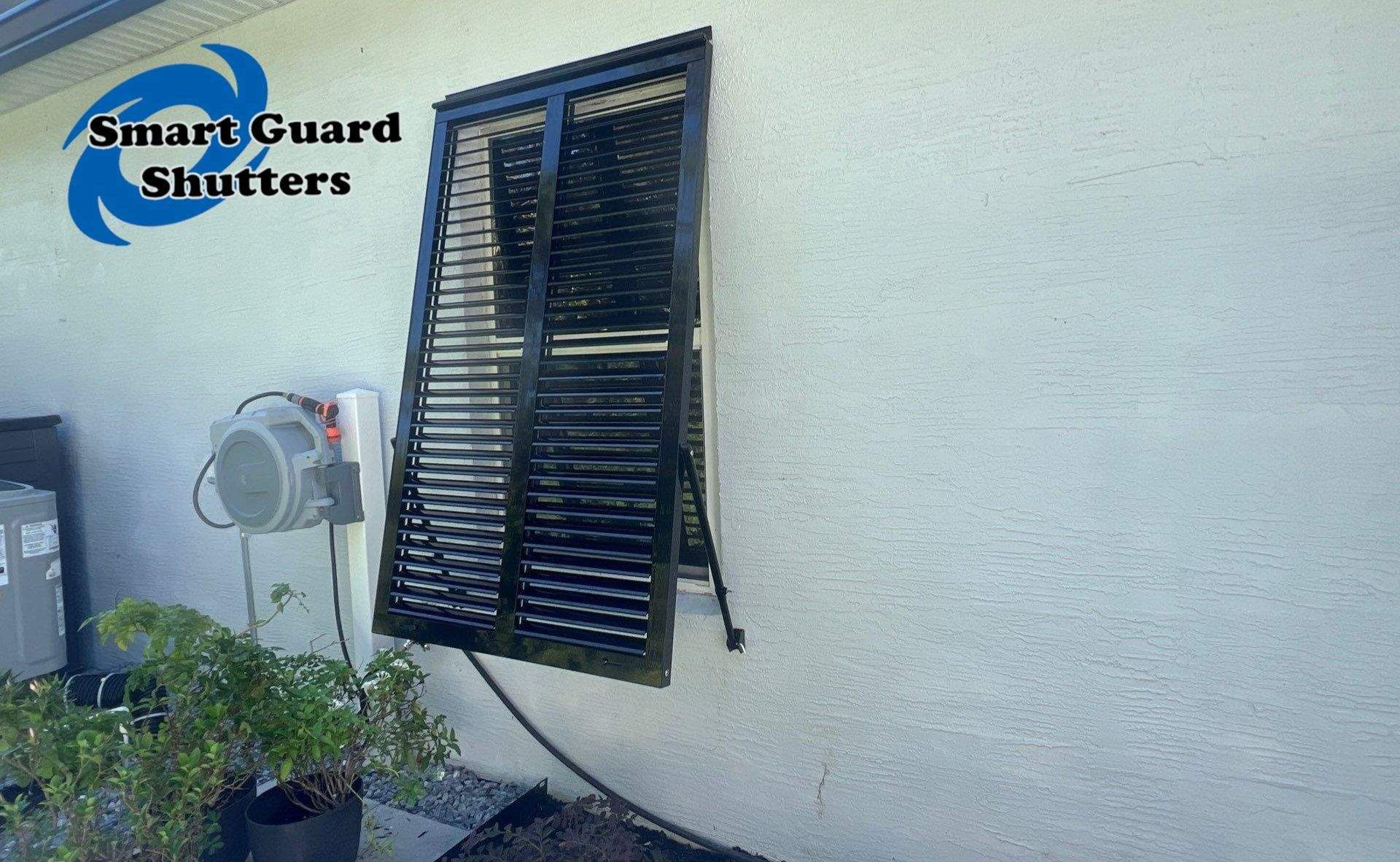 Impact Bahama Shutters in Jet Black by Smart Guard Shutters