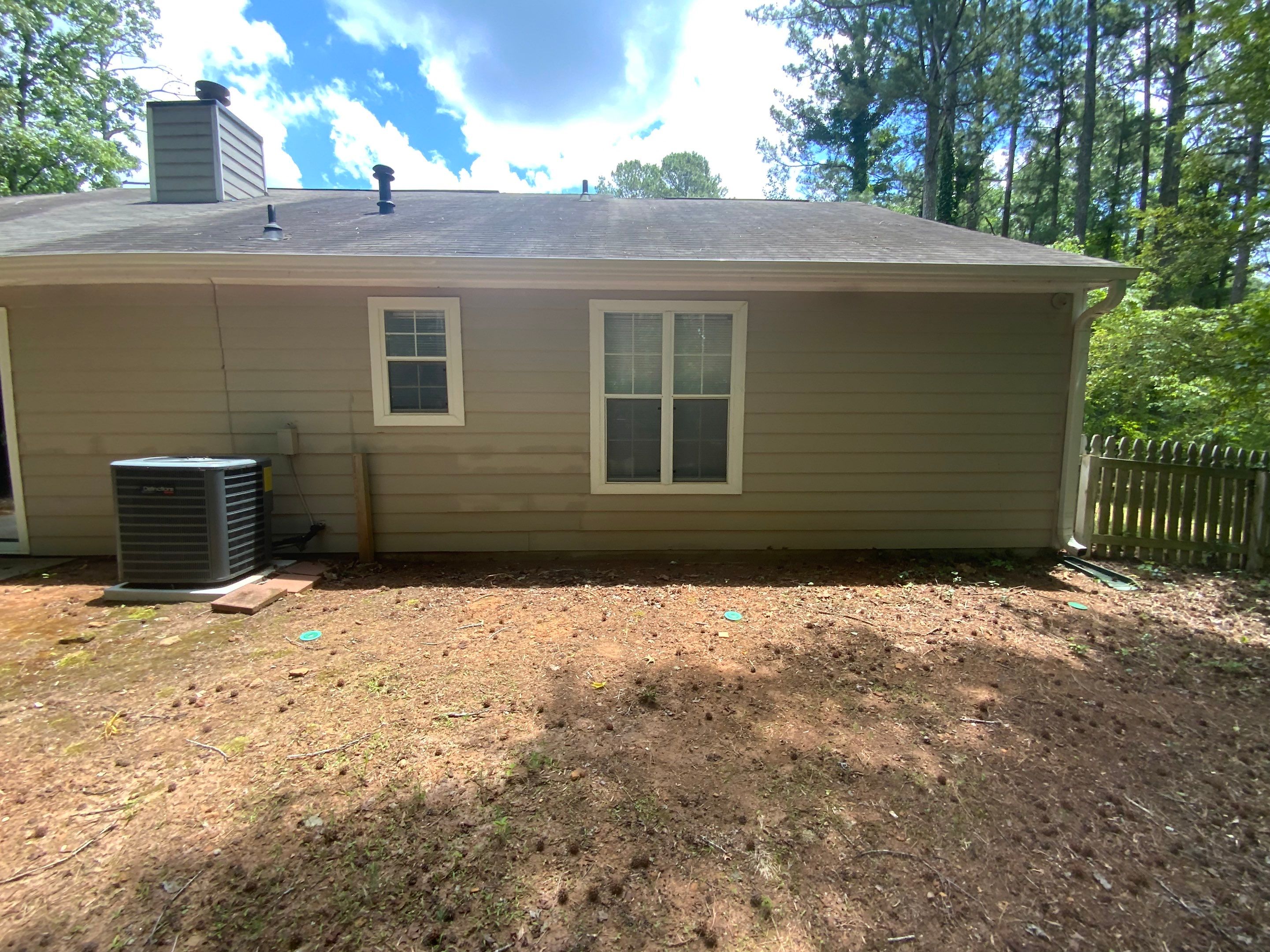 Exterior Siding Painting and Picket Fence Installation in Powder Springs by Swift Home Renovations