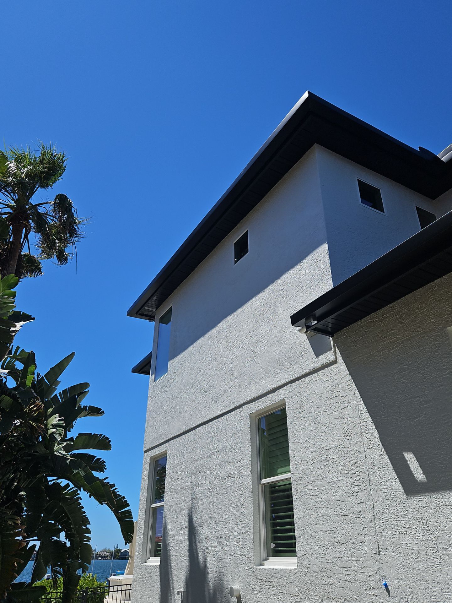 Soffit and Fascia Installation and black seamless gutters in Sarasota FL by Gutter Professors
