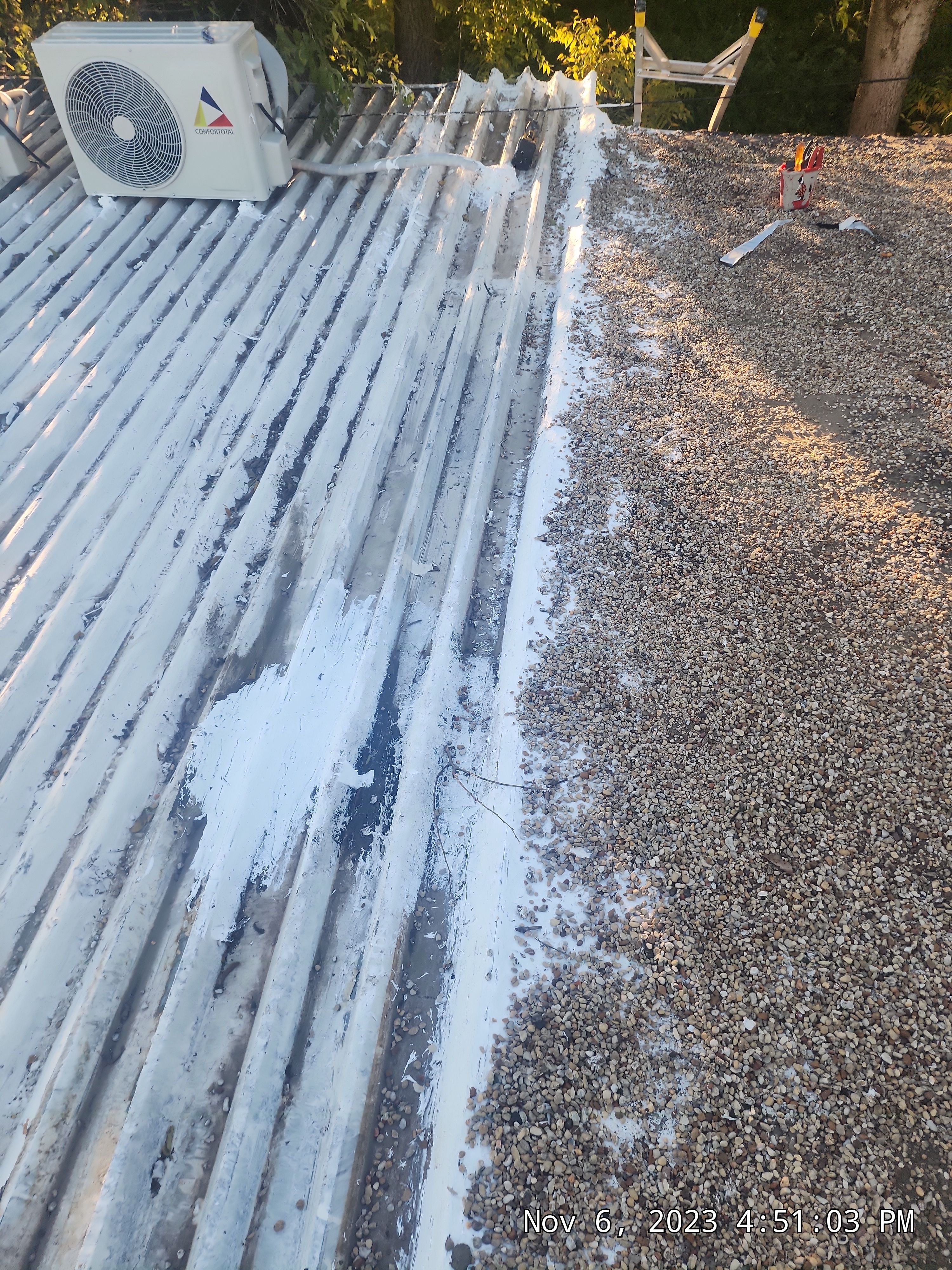 Commercial roofing overlay using GAF TPO over an old ballast roof by Becker Roofing and Exteriors