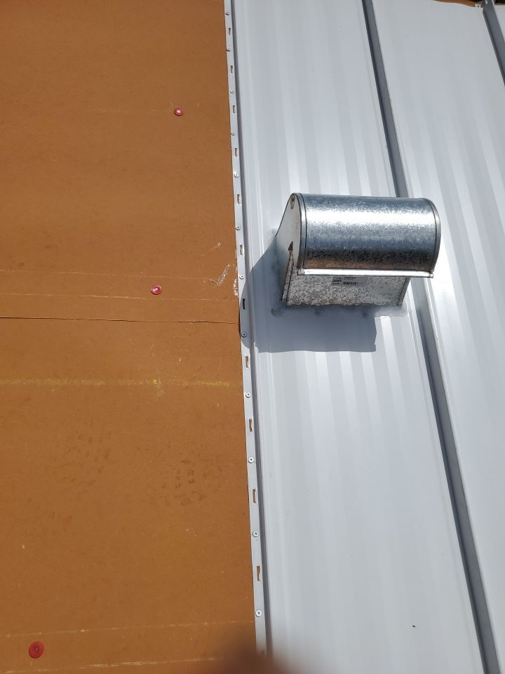 Residential Roofing Installation using 1.5" Nail Strip 24ga Solar White Kynar Coated Standing Seam Metal Panels by Morton Roofing, Inc.