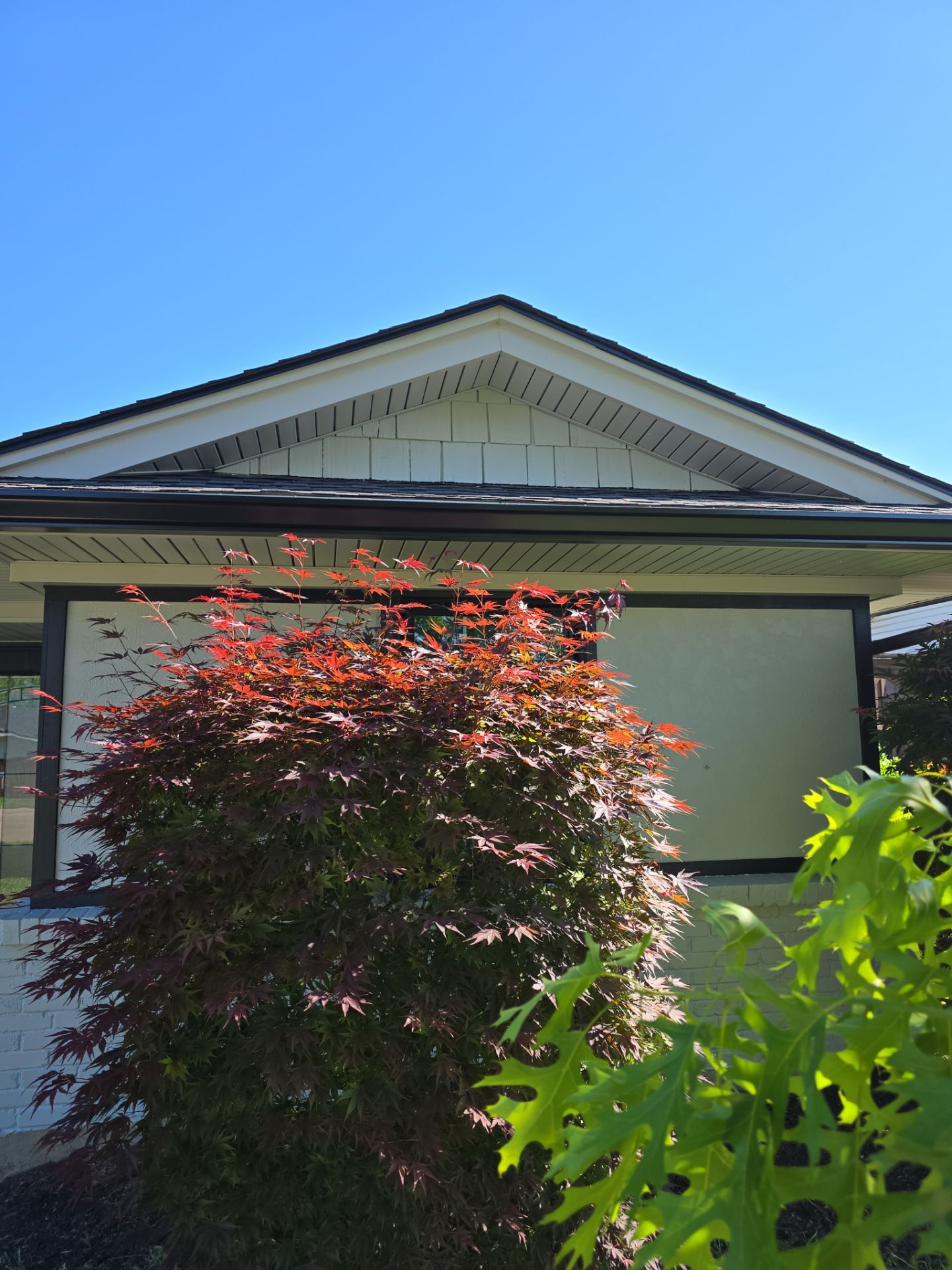 Exterior Home Paint Project with Different Surfaces by SLM General Contractors & Roofing