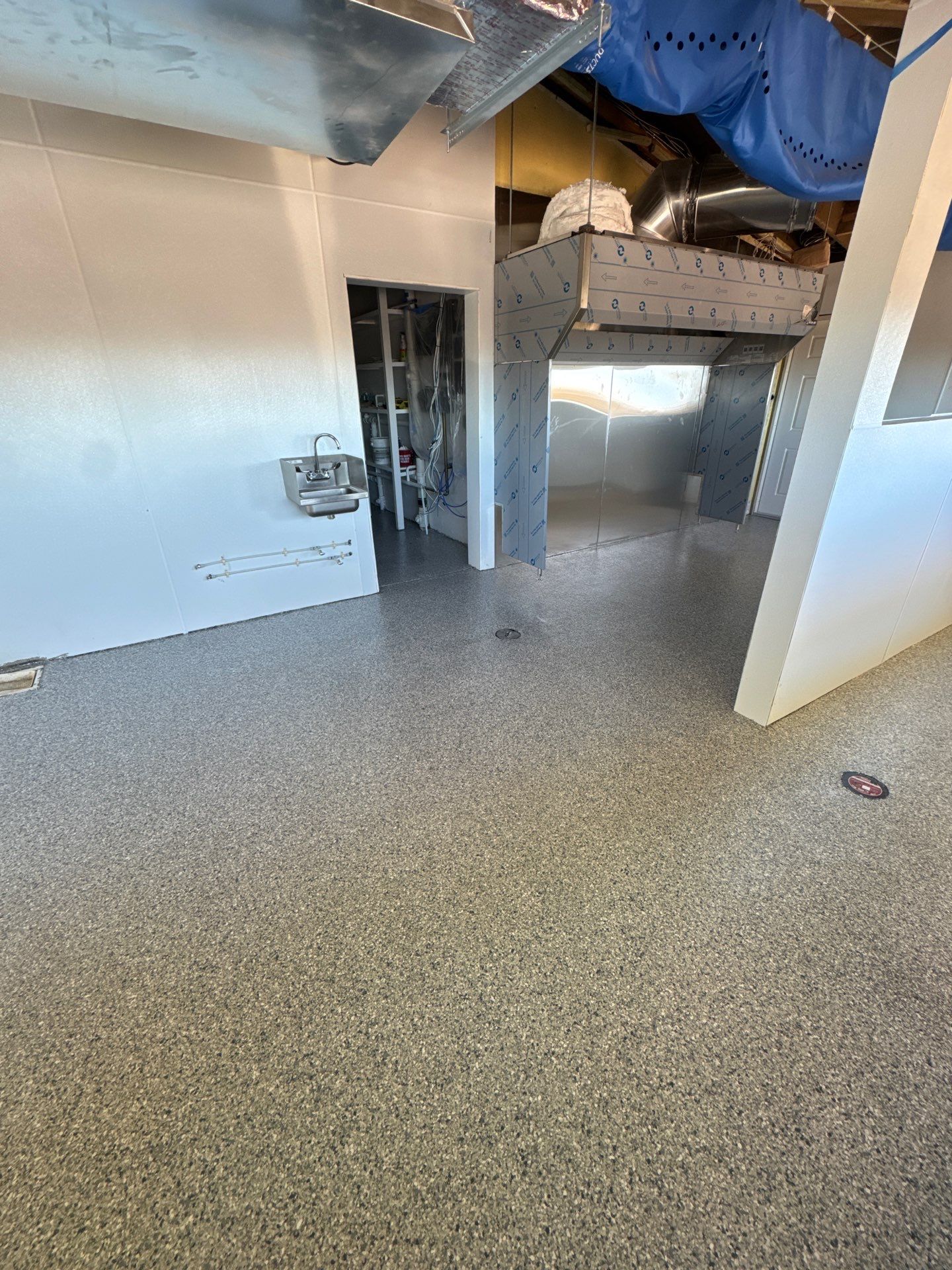 Commercial Restroom Refresh: Seamless 'Tidal Wave' Flake for a Repeat Client by Performance Floors & Coating