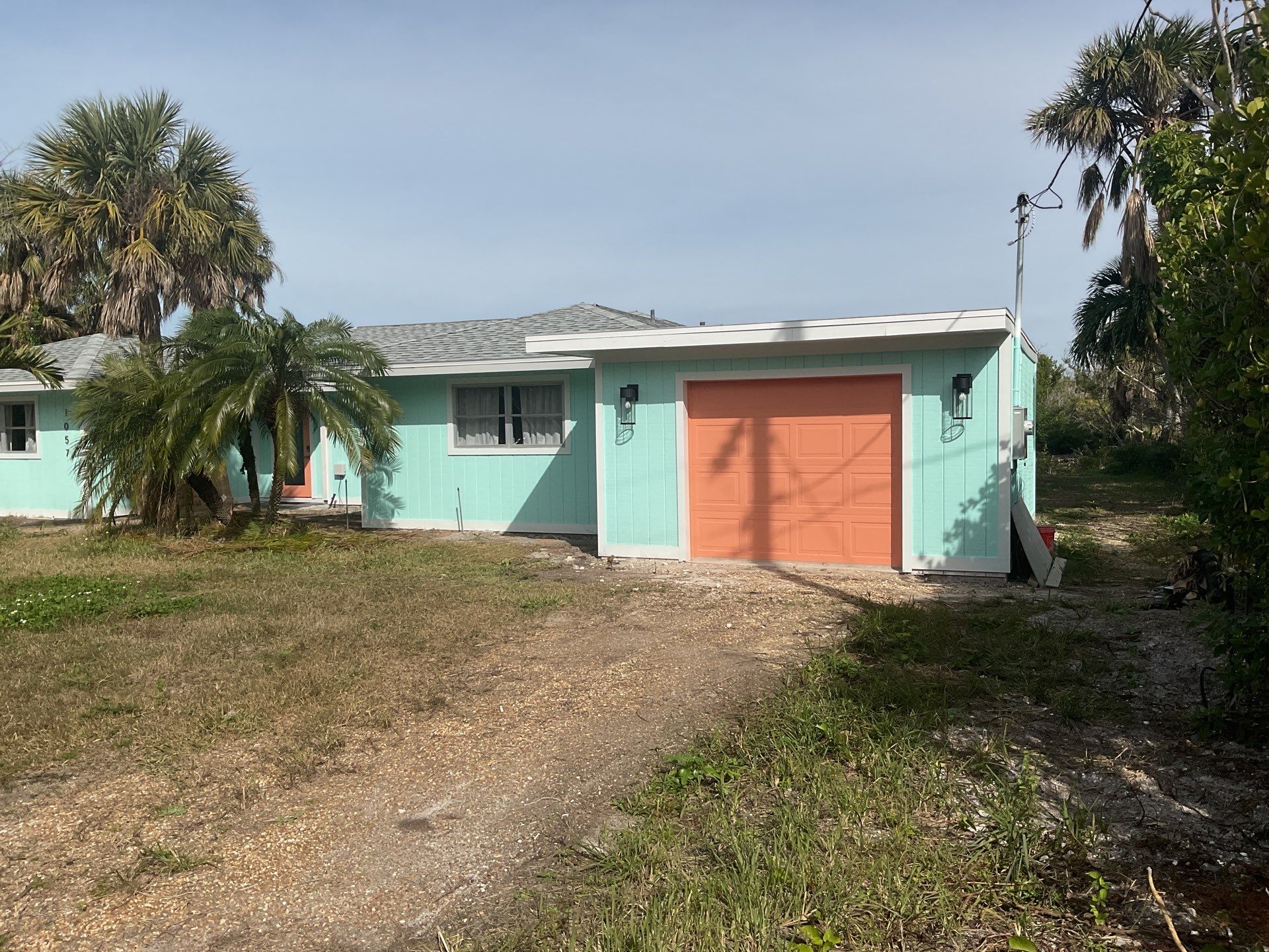 White Seamless Gutters Installation in Sanibel FL by Gutter Professors