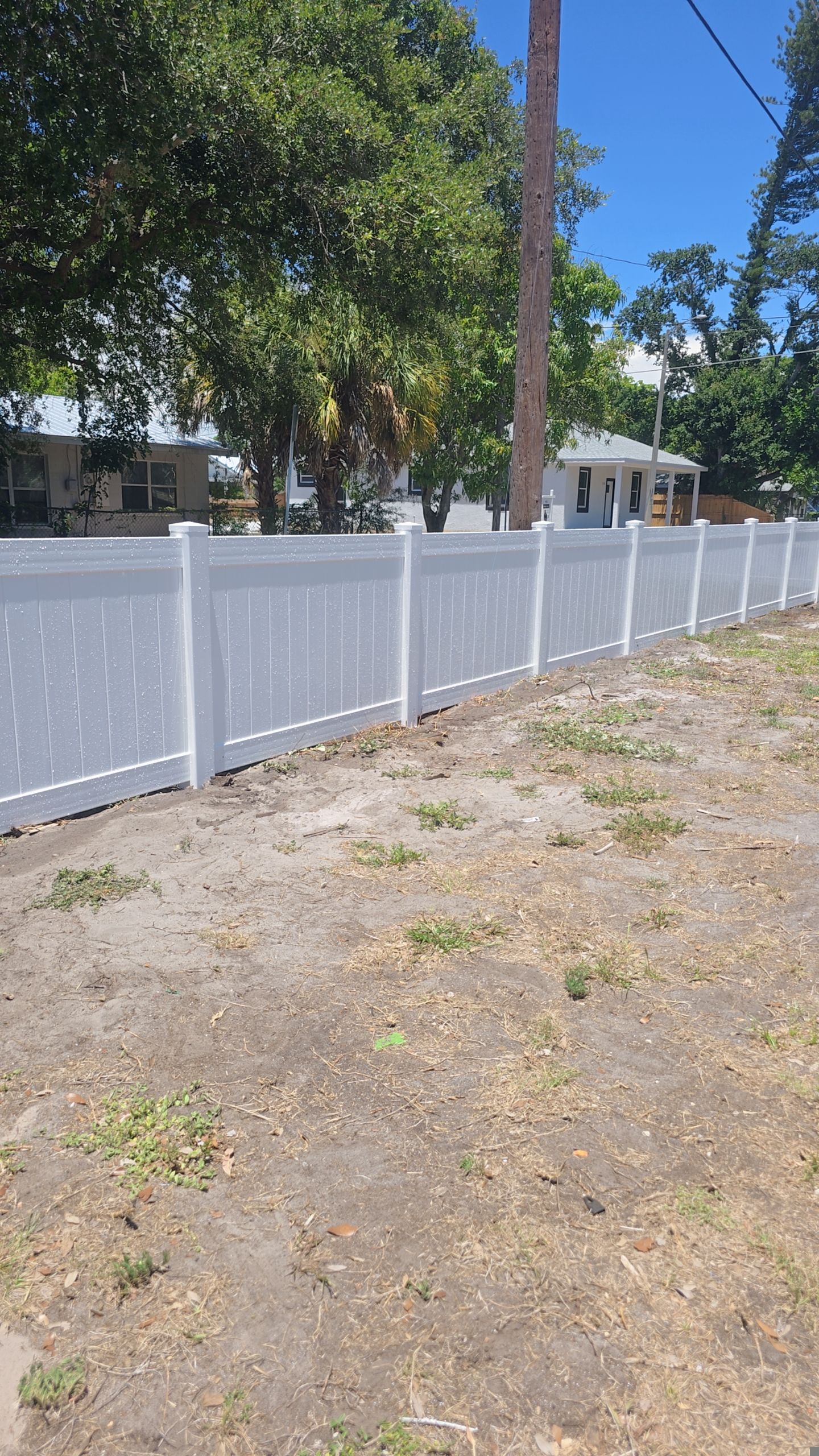 White Vinyl Privacy Fence and Gate Installation in Bradenton by True Fence LLC