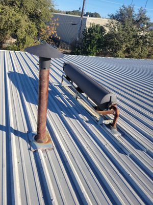 Metal roof with vent and pipe flashing installation