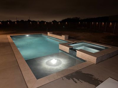 Geometric Pool with Elevated Spa and Night Lighting