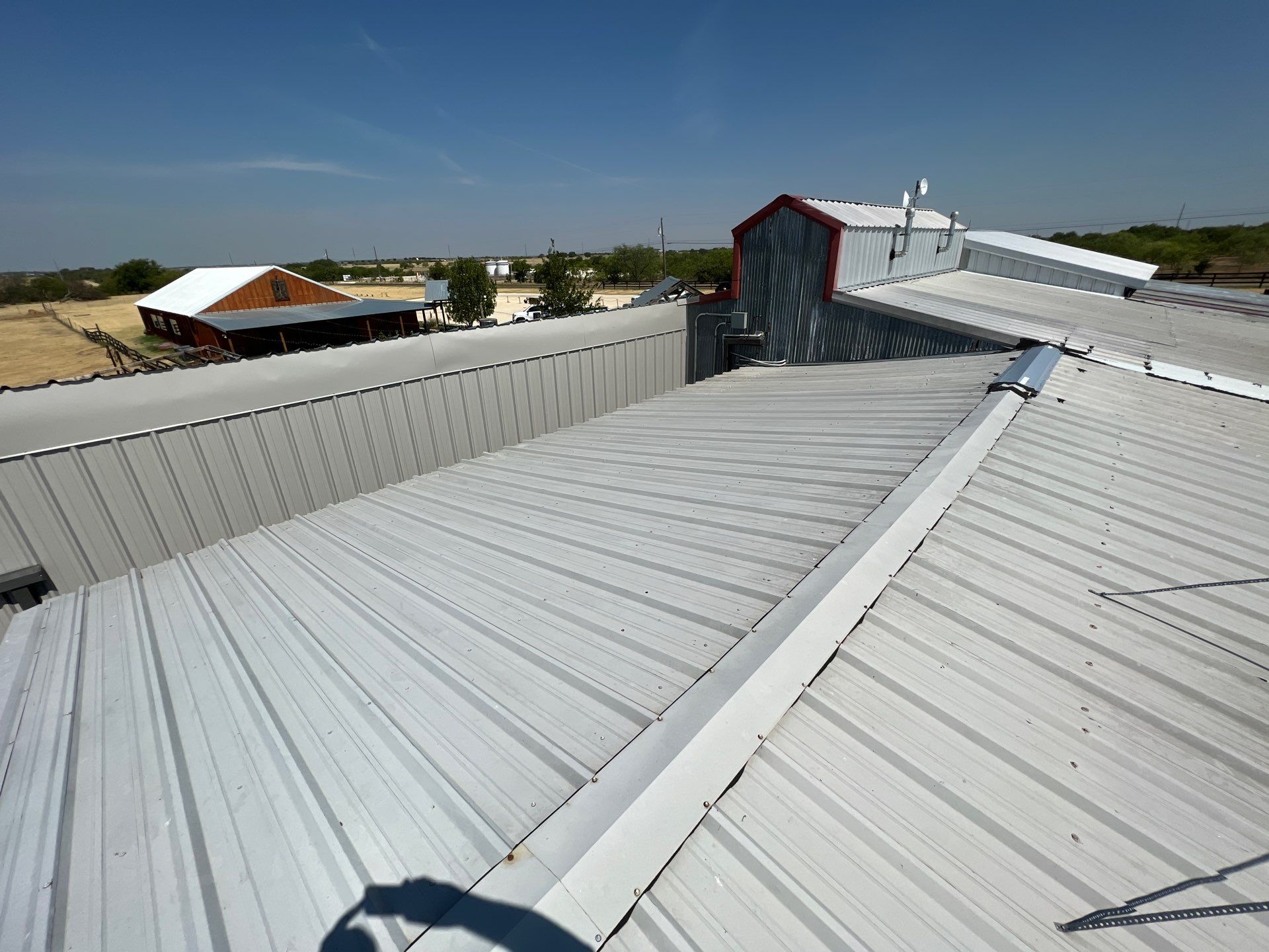 Commercial Roofing Repair using TRP #924 Eterna-Sil Premium Silicone Roof Coating by Harvey Roofing & Construction