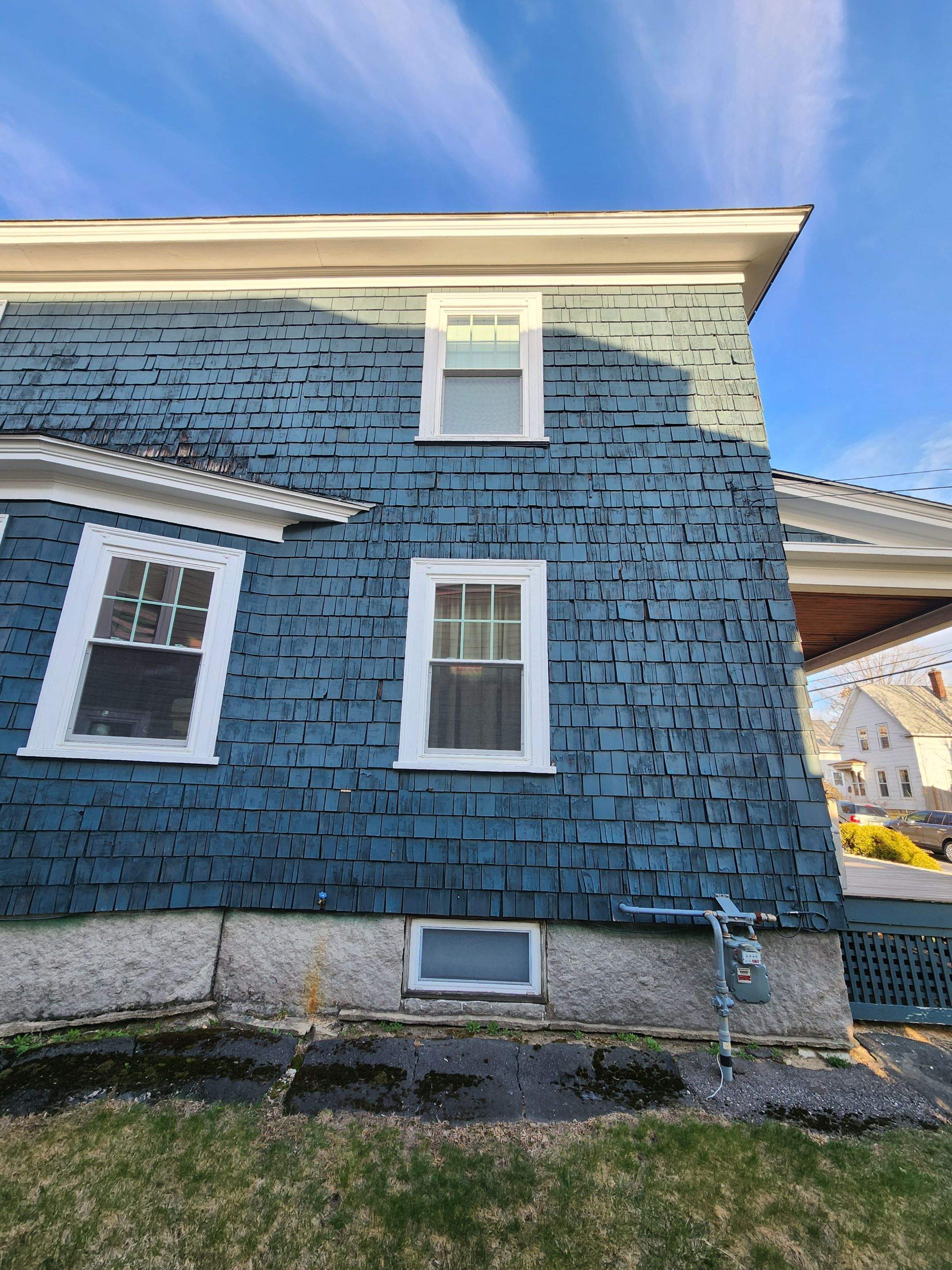 Siding replacement using cedar shakes by Freedom Handyman Services