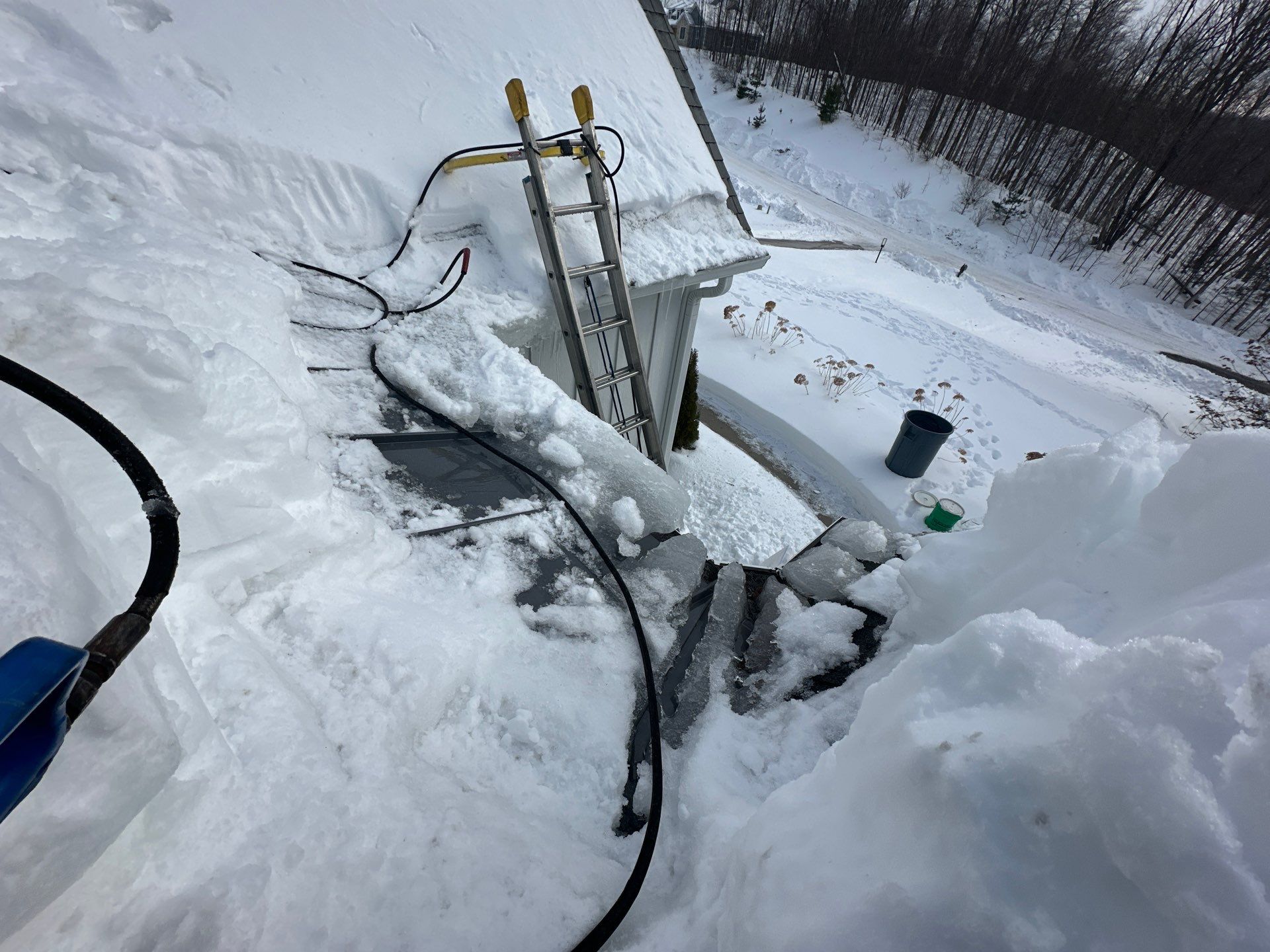 Residential Ice Dam Removal in Traverse City by Rainbow Seamless Systems
