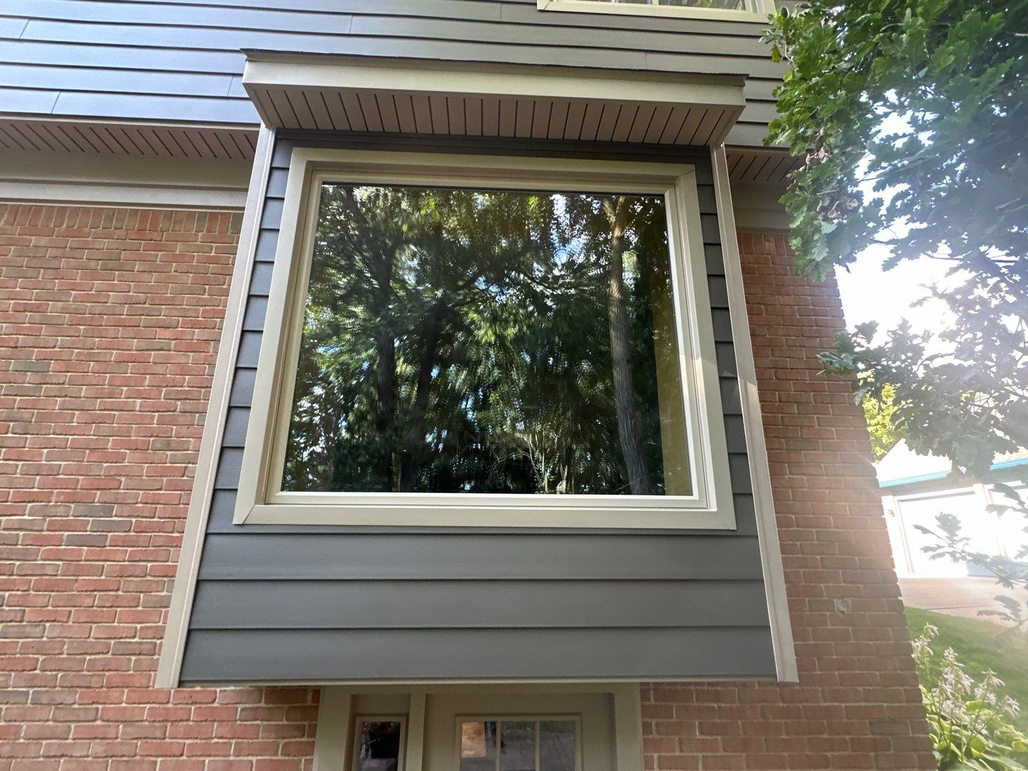 Roof Replacement using Owens Corning Peppercorn and Siding Replacement using Ascend Charcoal Smoke by 180 Contractors