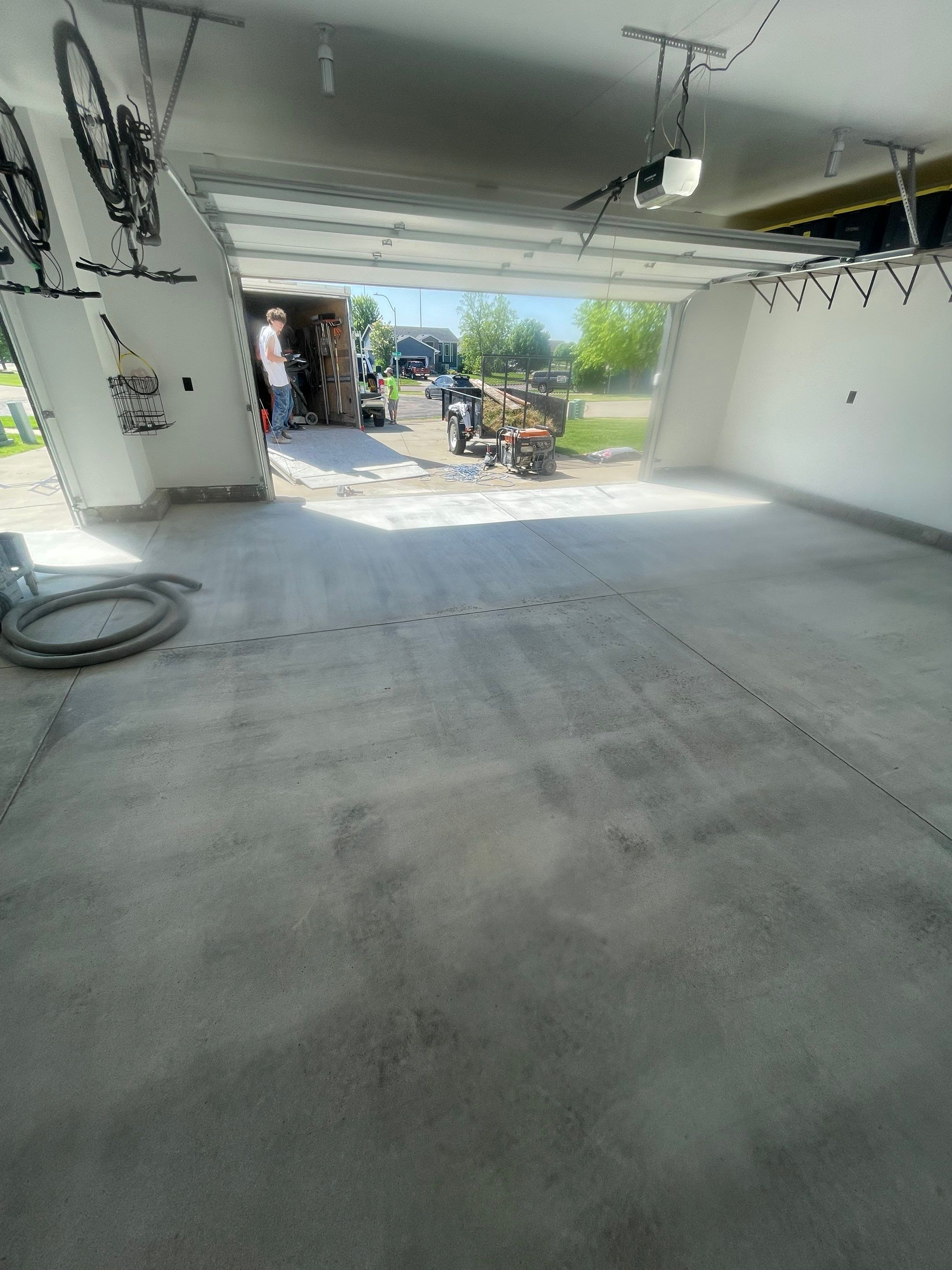Tidal Wave Flake Garage Floor Installation in Sioux Falls by Select Painting, Coatings & Garage Cabinets
