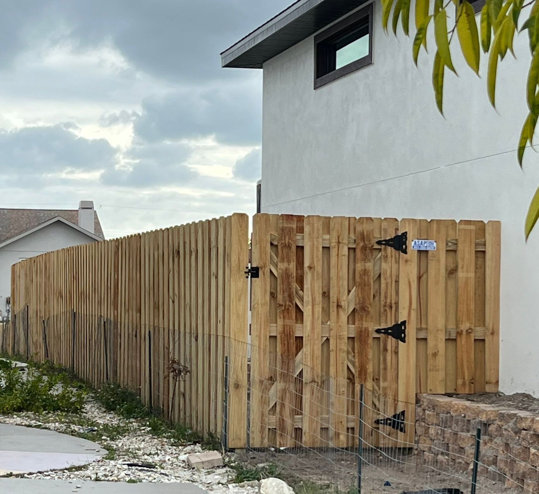 Wood Fence Installation using 6Ft Tall Pressure Treated Wood Shadowbox Fence by Asap fence and gates, LLC