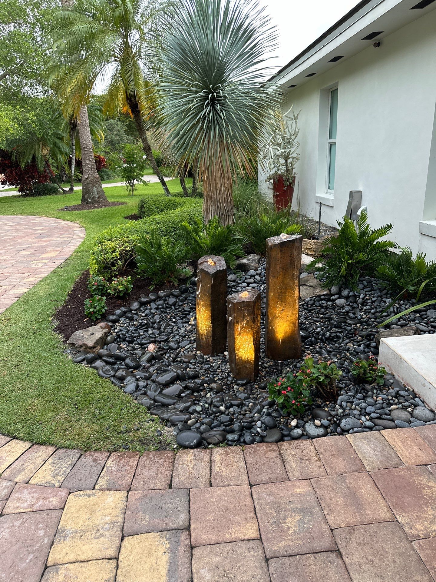 Pinecrest Fountain at Door Entrance by Nature's Dream Landscape and Tree Service