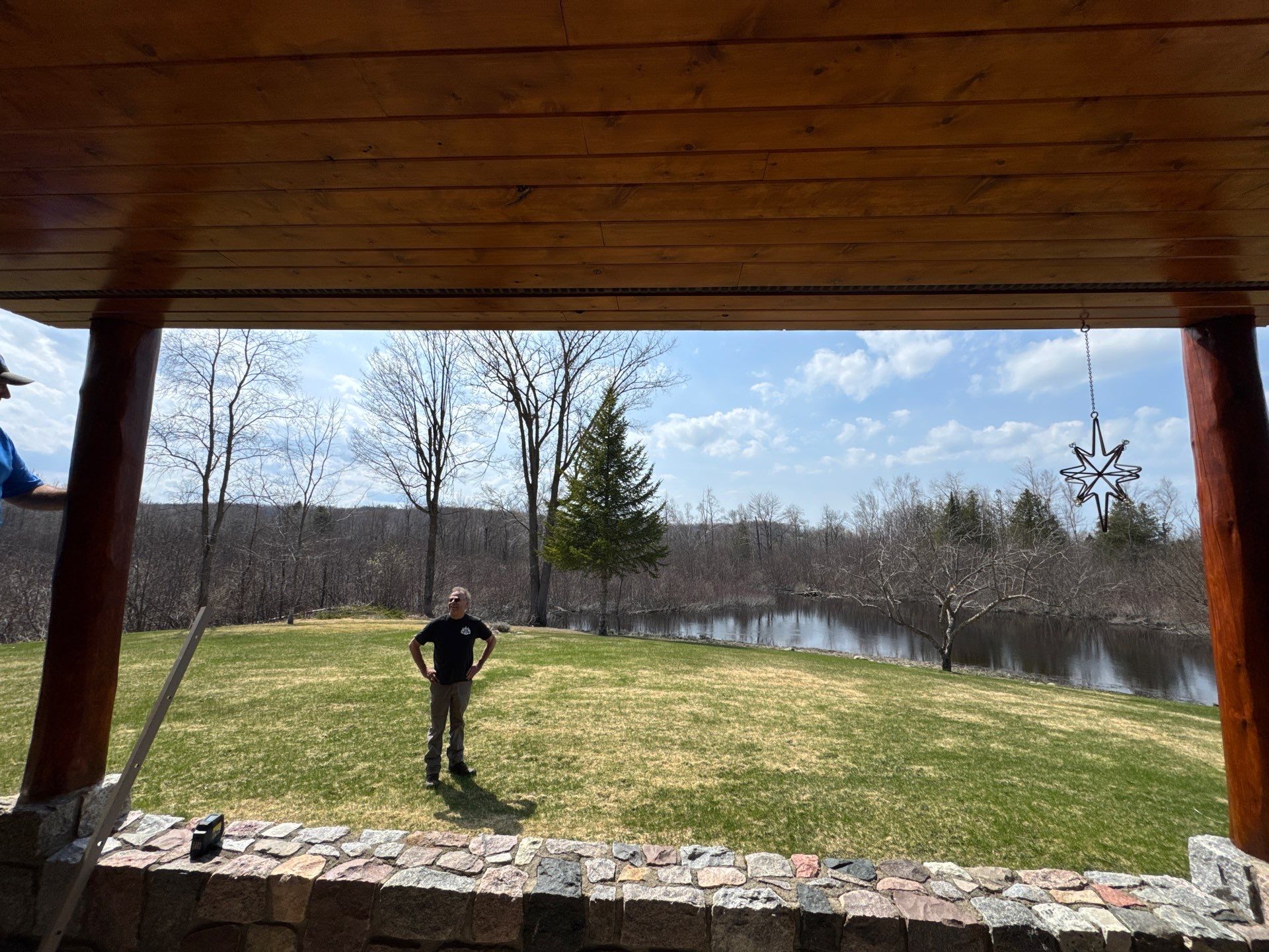 Sunesta Retractable Screen Installation on a Petoskey Log Home Porch by Rainbow Seamless Systems